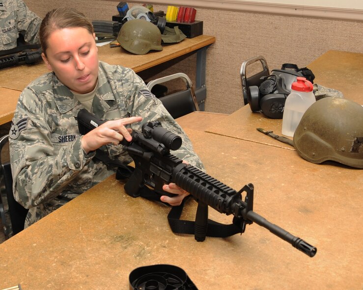 Senior Airman Holly Sheedy, 26th Operations Weather Squadron weather forecaster, places her M-4 on safe mode during the new Rifle/Carbine Air Force Qualification Course at Barksdale Air Force Base, La., Aug. 8. Airmen preparing to deploy or permanently change stations to an overseas location are required to attend the new Riffle/Carbine Air Force Qualification Course prior to departing Barksdale. (U.S. Air Force photo/Senior Airman Sean Martin) (RELEASED)