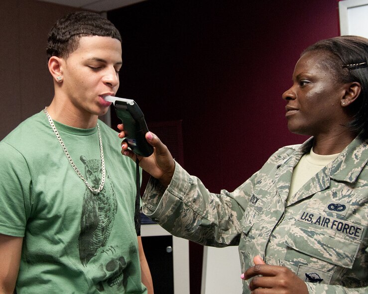 HANSCOM AIR FORCE BASE, Mass. - Senior Airman Stephanie Dyke, 66th Security Forces Squadron, conducts a sobriety test on Jordan Gonzales in a field sobriety test certification training held at the Education and Training Center Aug. 2. FSTs are conducted when an officer believes an individual is intoxicated by alcohol and is used as probable cause to detain or apprehend. (U.S. Air Force photo by Linda LaBonte Britt)