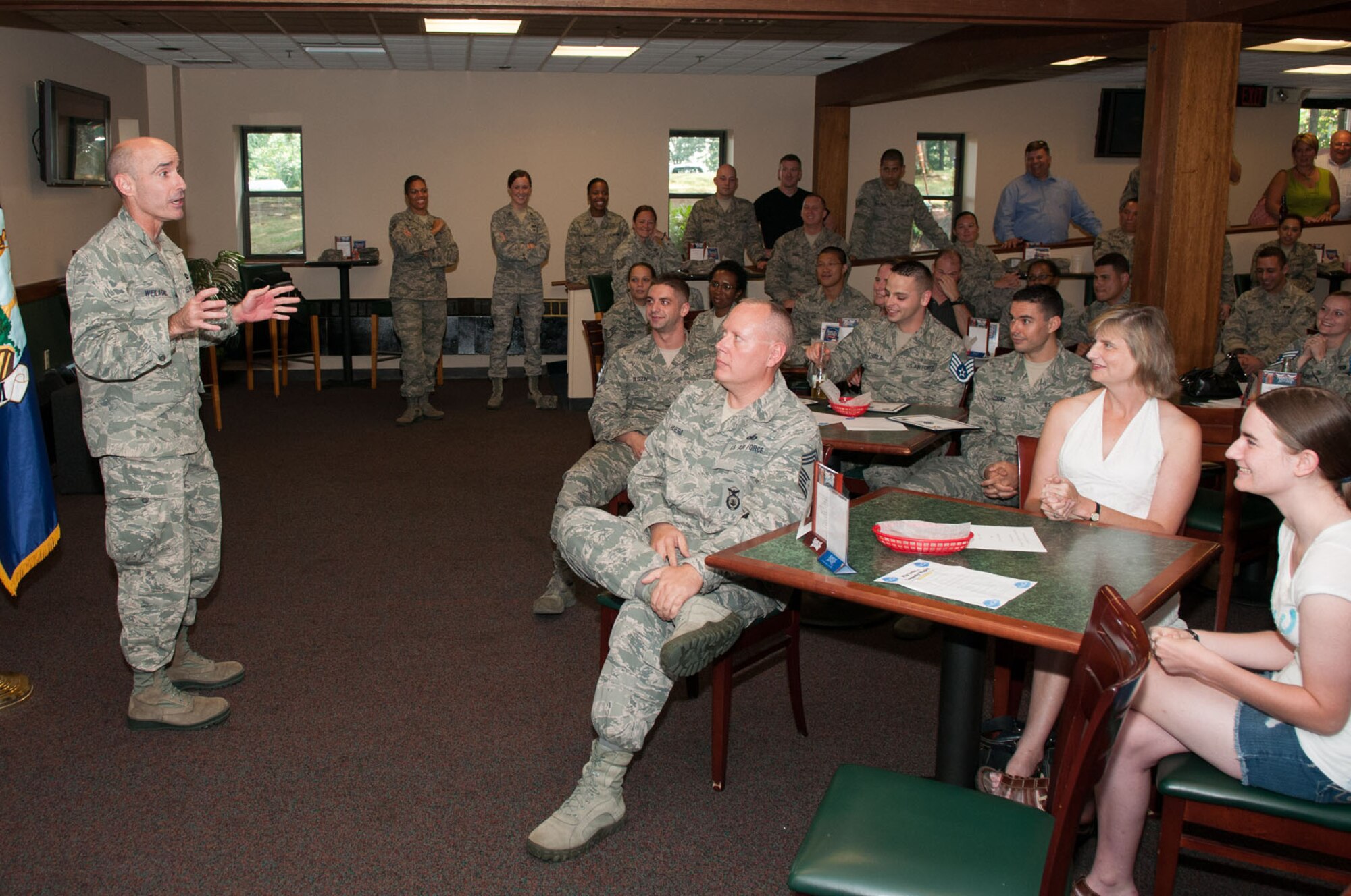 HANSCOM AIR FORCE BASE, Mass. – Col. Lester A. Weilacher, 66th Air Base Group commander, talks to the newest staff sergeant selects during the promotion release celebration at the Minuteman Commons Aug. 3. A total of 17 senior airmen were selected to move to the NCO ranks. (U.S. Air Force photo by Rick Berry)
