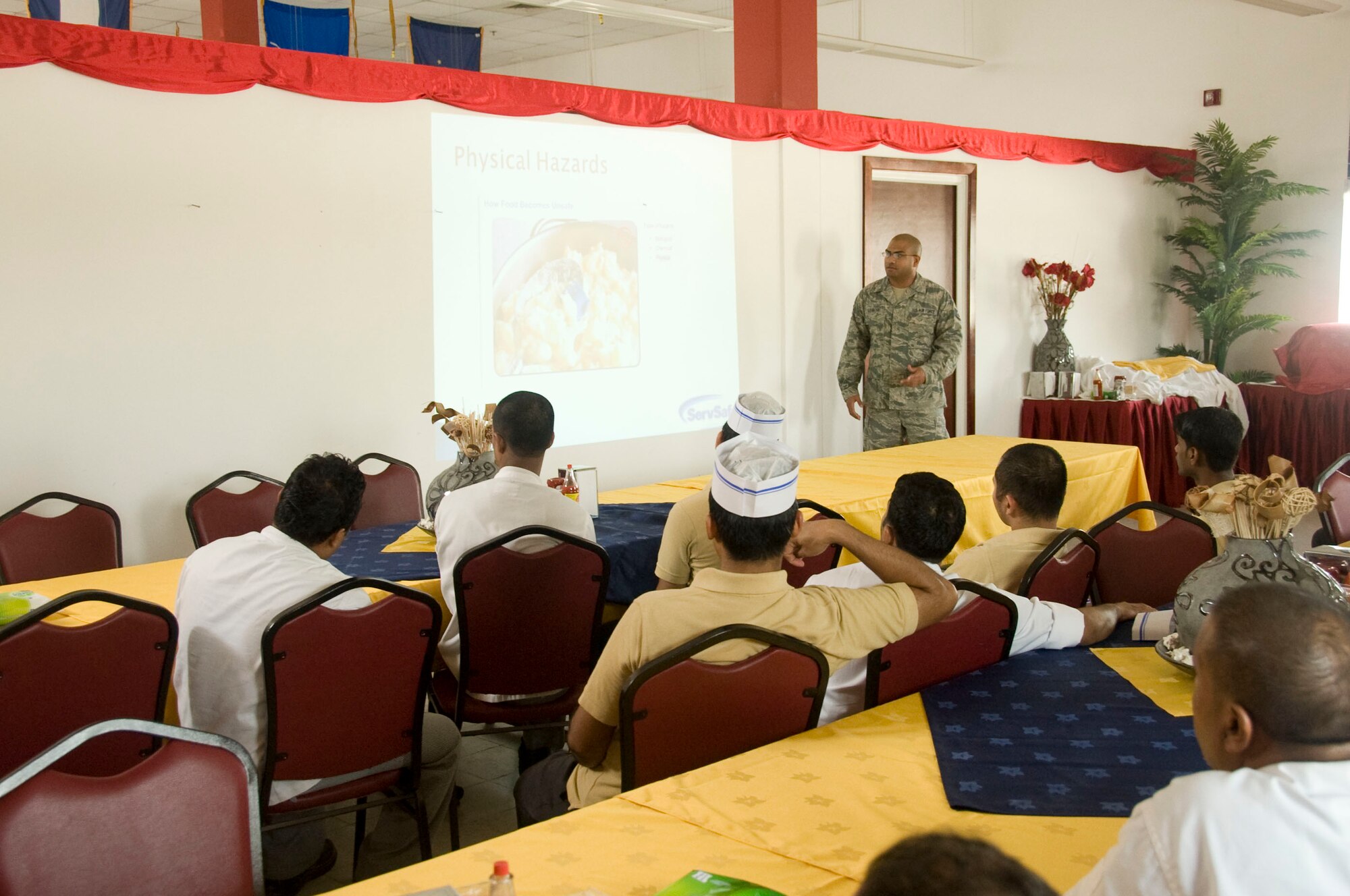 Staff Sgt. Ricardo Lemos, 379th Expeditionary Medical Group Public Health operations manager, conducts Food Handler Training for dining facility employees and managers Aug.6, 2012 in Southwest Asia. Along with this training, Public Health Airmen’s main role is to prevent and control the spread of communicable diseases. (U.S. Air Force photo/Senior Airman Bryan Swink)