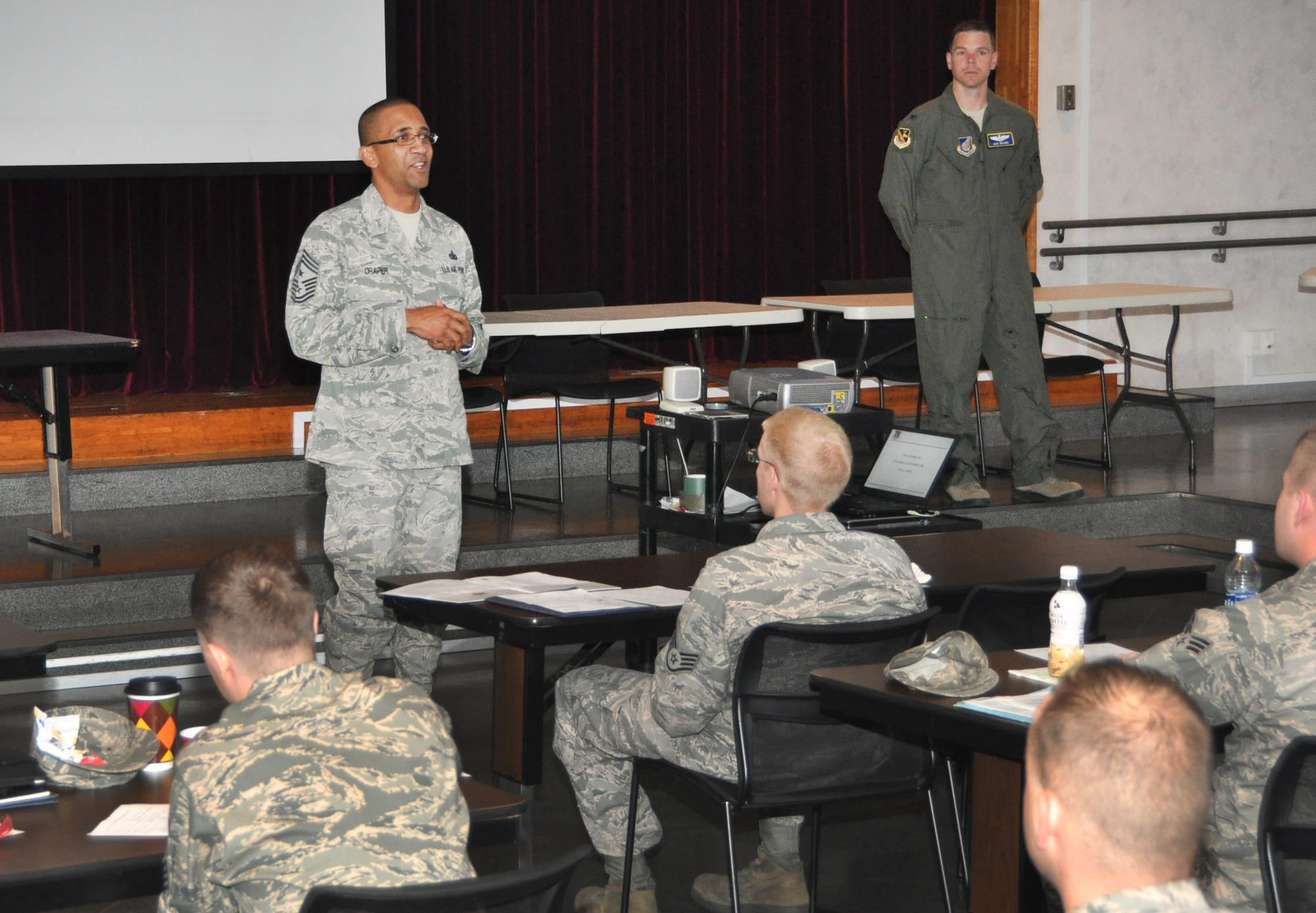 YOKOTA AIR BASE, Japan -- Chief Master Sgt. Ronald Draper, 374th Airlift Wing Command Chief Master Sergeant, welcomes newcomers to Team Yokota, during the first day of Right Start, Aug. 8, 2012 at Yokota Air Base, Japan. The Airman and Family Readiness Center provides briefings from more than 25 organizations and leaders from around Yokota during Right Start. (U.S. Air Force photo by Senior Airman Katrina R. Menchaca)