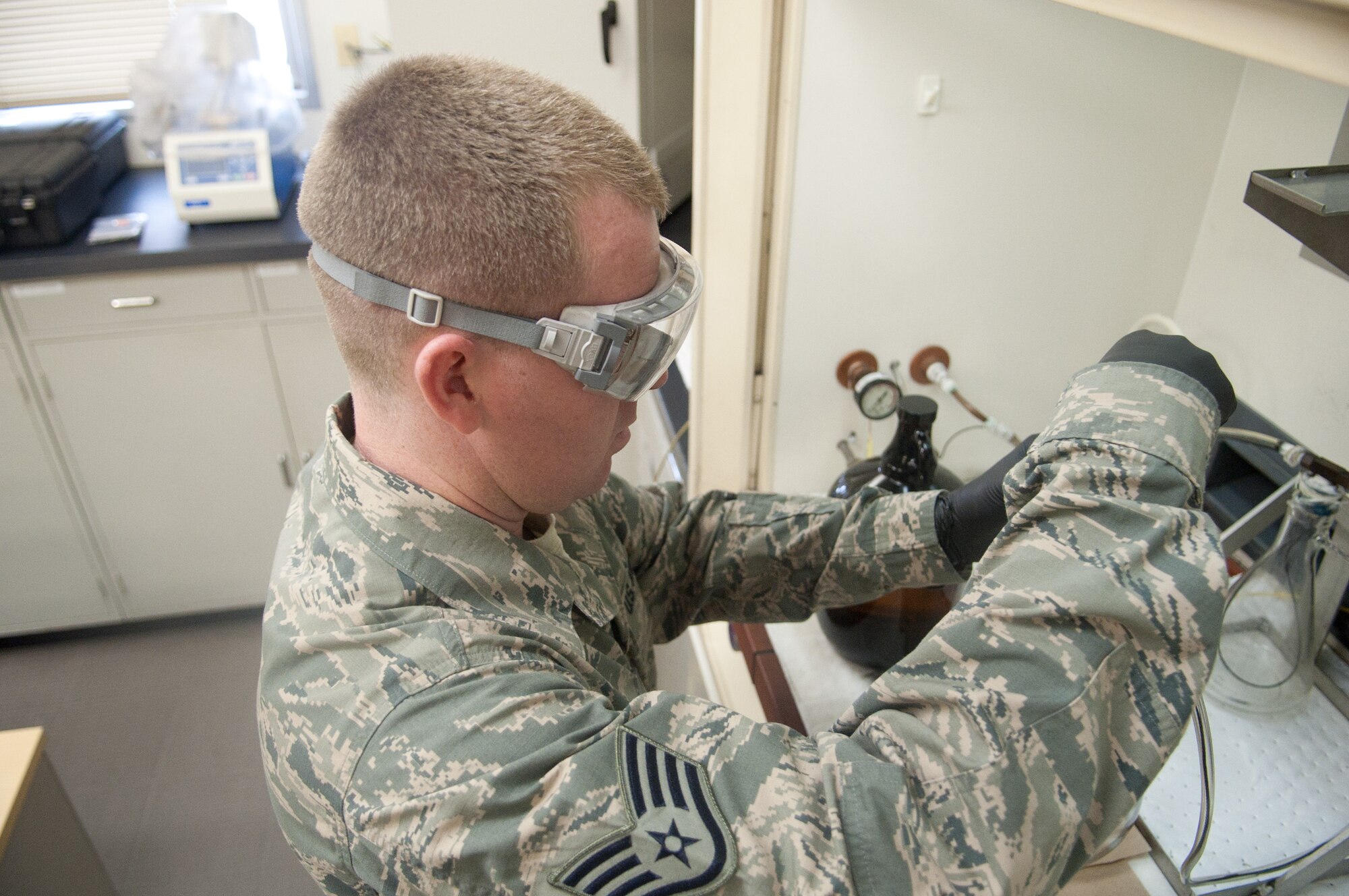YOKOTA AIR BASE, Japan -- Staff Sgt. Jeremiah Palmer, 374th Logistics Readiness Squadron Petroleum, Oils and Lubricants fuels laboratory NCO in charge, tests fuel at Yokota Air Base, Japan, on Aug. 7, 2012. Tests are performed monthly to ensure fuel used on Yokota meets Air Force safety standards. (U.S. Air Force photo by Airman 1st Class John D. Partlow)