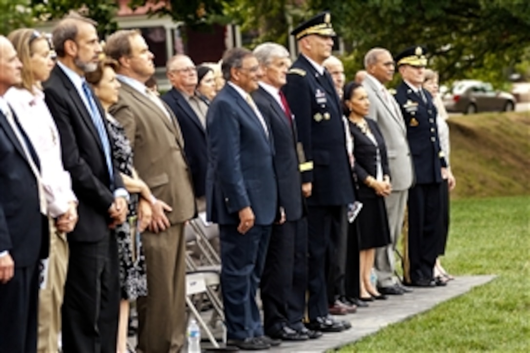 Defense Secretary Leon E. Panetta, center, Army Secretary John M. McHugh, Army Chief of Staff Gen. Ray Odierno and Army Gen. Martin E. Dempsey, far right, chairman of the Joint Chiefs of Staff, stand for honors during Twilight Tattoo, a military pageant, at Whipple Field on Joint Base Myer-Henderson Hall in Arlington, Va., Aug. 8, 2012.