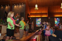 Volunteers from First Baptist Church of Friendsville, Tenn., lead Vacation Bible School participants in devotional song at the Marine Corps Air Station New River, N.C., Chapel, July 18. The volunteers held VBS to teach children about Christianity, July 16-19.