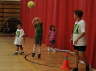 Tammy Jaffers, youth sports coach, moderates a game of soccer that pits children against their parents, July 13. Children from the Exceptional Family Member Program aboard Marine Corps Air Station New River, N.C., participated in a weeklong soccer camp, July 9-13.