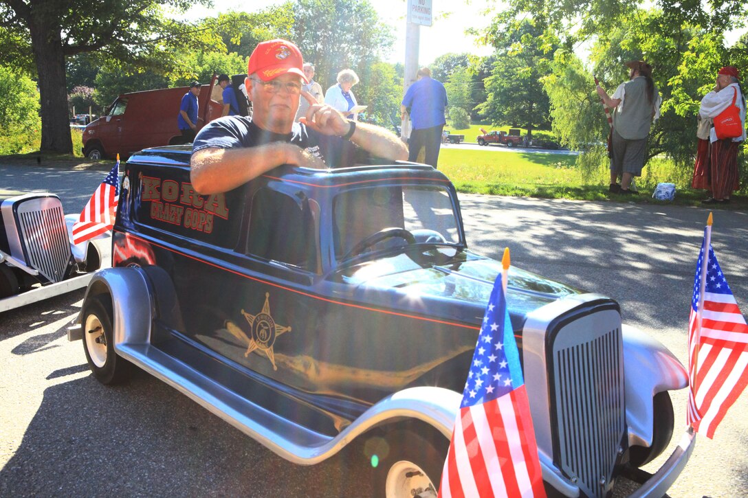 Brett Jervis, a retired Marine captain who went to boot camp in 1968, sits in his small replica of a 1935 “Paddy Wagon” before taking part in the parade for Maine’s 2012 Lobster Festival in Rockland, Aug. 4. Jervis, who served for 11 years in the Marine Corps, drives the vehicle in numerous parades every year and still wears a baseball cap with the Marine Corps’ emblem on a regular basis. (Photo by Lance Cpl. Paul Peterson)