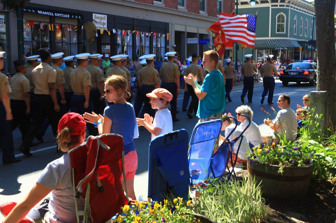 Visitors to the parade for Maine’s 2012 Lobster Festival in Rockland applaud the Marines and sailors of the 2nd Marine Logistics Group sent to support the event, Aug. 4. Approximately 30 Marines and sailors from the 2nd Marine Logistics Group and 100 crewmembers of the USS San Antonio took part in the parade. (Photo by Lance Cpl. Paul Peterson)