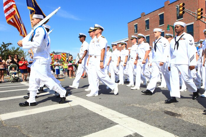 The crew of the USS San Antonio marches through the streets of Rockland, Maine, during the 2012 Lobster Festival, Aug. 4. Approximately 30 Marines and sailors from the 2nd Marine Logistics Group and 100 crewmembers of the USS San Antonio took part in the parade. The city gave them the honor of marching at the front of the parade. (Photo by Lance Cpl. Paul Peterson)