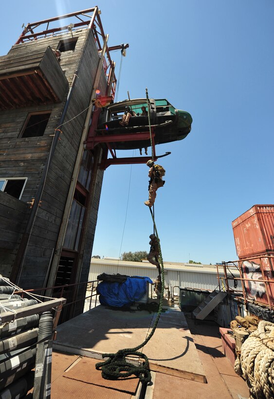 San Diego - Marines with the 11th Marine Expeditionary Unit's Maritime Raid Force conduct fast-rope training at the Strategic Operations Facility here Aug. 7. The raid force consists of a reconnaissance element, an infantry element, an Intelligence element, explosive ordnance disposal Marines and a 1st Air Naval Gunfire Liason Company detachment. (U.S. Marine Corps photo by Gunnery Sgt. Chance W. Haworth/RELEASED)