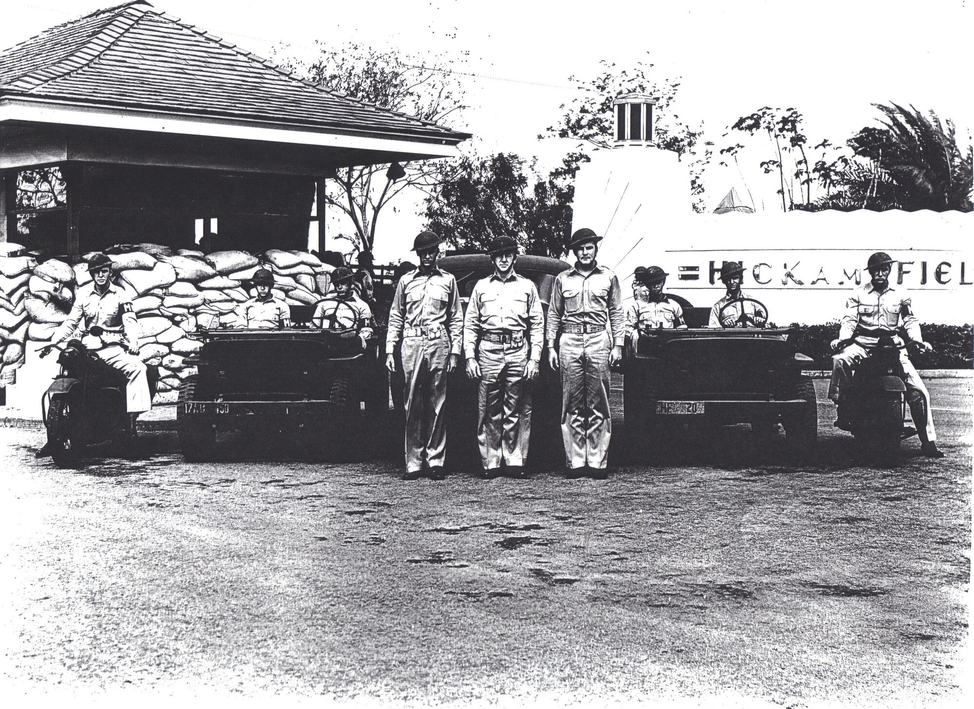 Durward Swanson, sitting on the far left motorcycle, poses with his patrol team at the front  gate of Hickam Field in this early 1942 post-attack photo. Swanson was a staff sergeant in the Army Air Corps when the Japanese executed their surprise attack of the military installations on the Hawaiian island of Oahu. Swanson went on to the Battle of Midway in June 1942 as a crew chief, where his B-17 was shot down, leaving him with injuries to his leg, side and face. (Courtesy photo) 