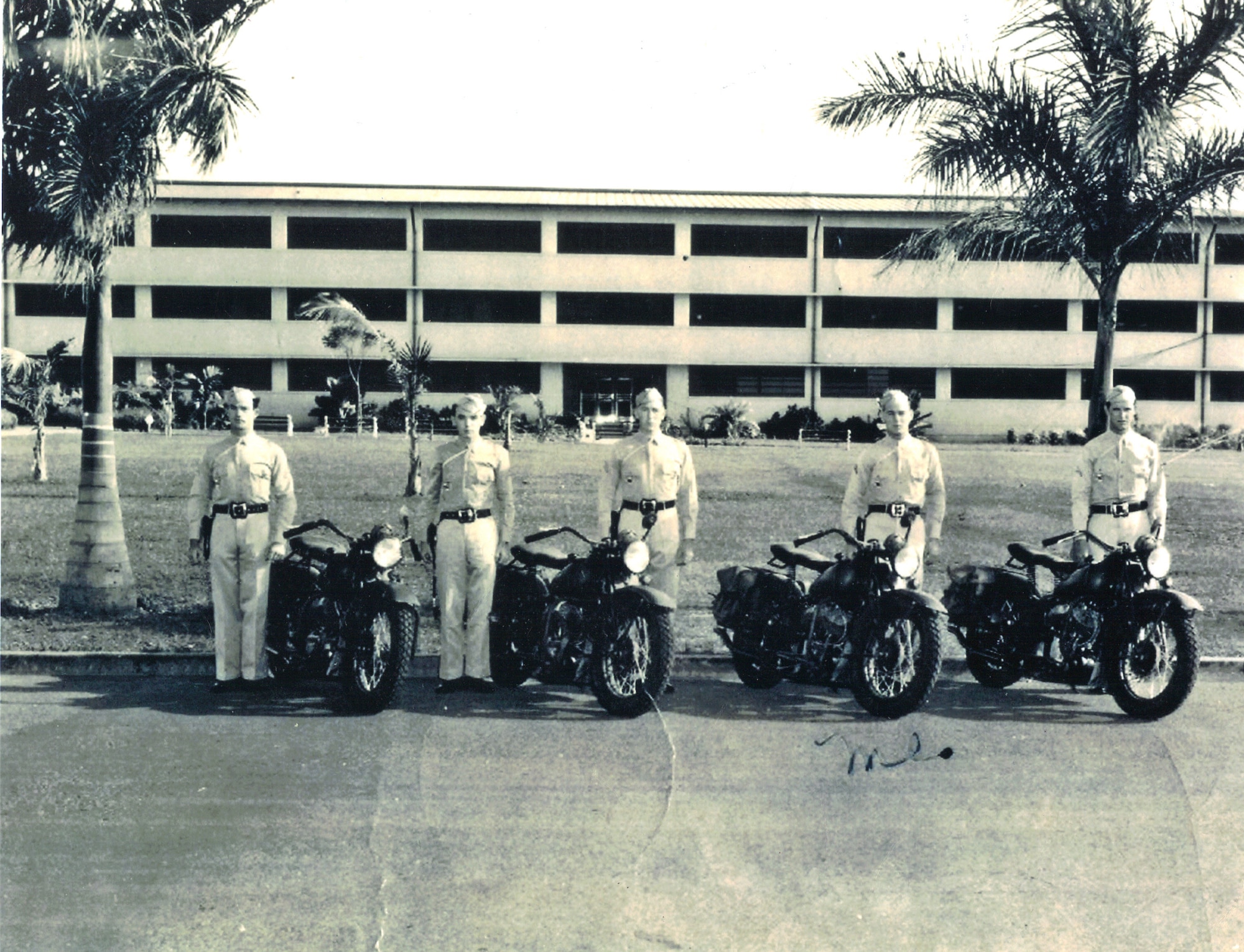 Durward Swanson, third from the left, stands with his patrol team in front of the 3,200-man consolidated barracks early 1941 photo at Hickam Field. Swanson was a staff sergeant in the Army Air Corps when the Japanese executed their surprise attack of the military installations on the Hawaiian island of Oahu. Swanson went on to the Battle of Midway in June 1942 as a crew chief, where his B-17 was shot down, leaving him with injuries to his leg, side and face. (Courtesy photo) 