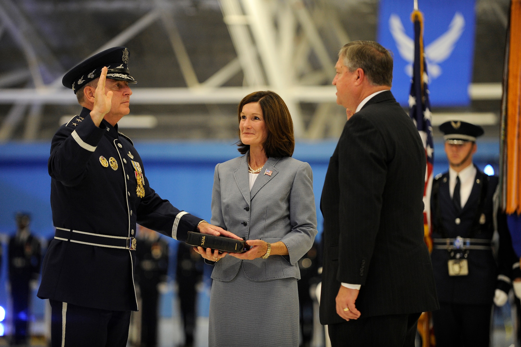 Secretary of the Air Force Michael Donley swears in Gen. Mark A. Welsh III as the 20th Air Force chief of staff, assisted by Welsh's wife, Betty, during a ceremony at Joint Base Andrews, Md., Aug. 10, 2012. (U.S. Air Force photo/Scott M. Ash)