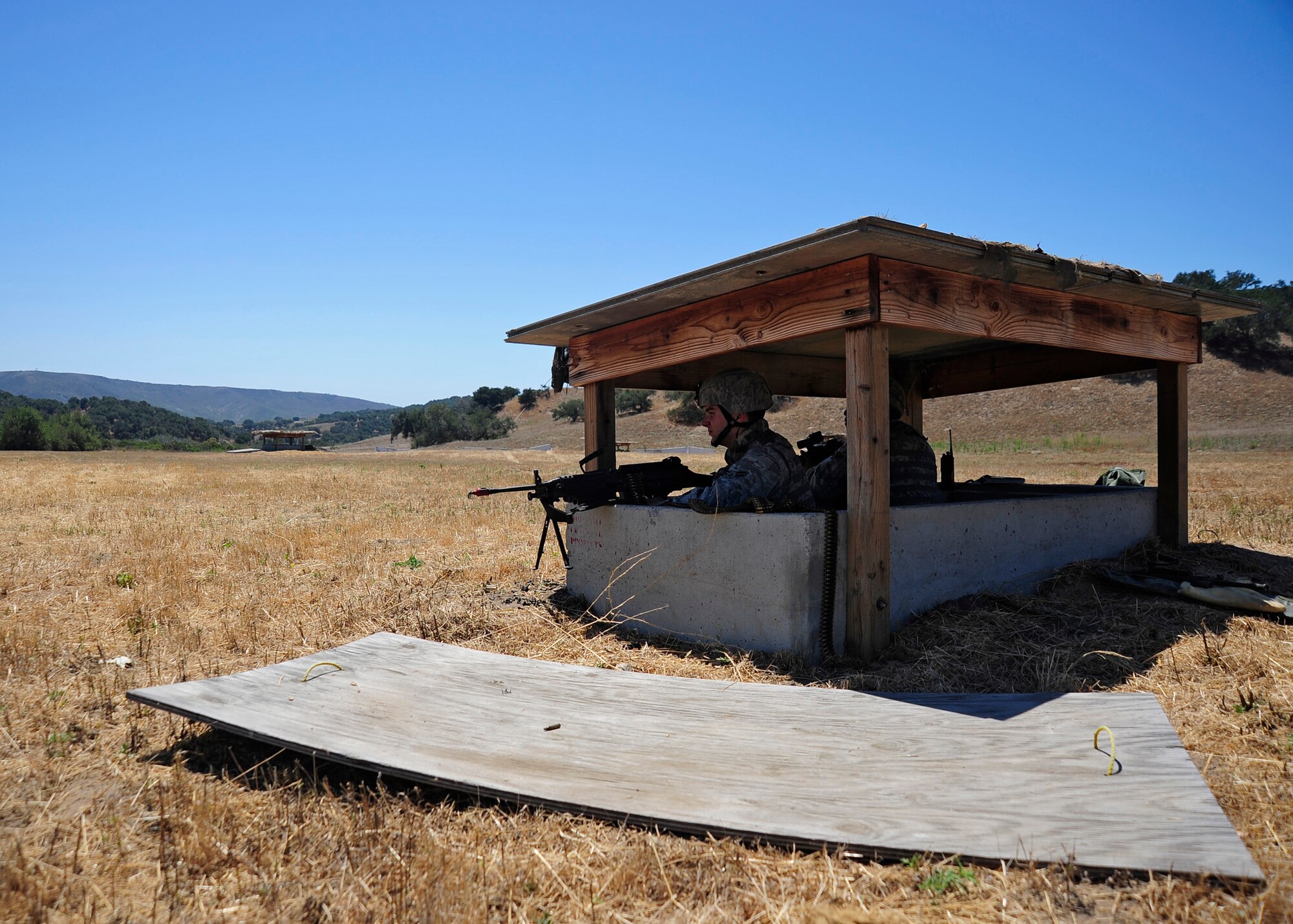 VANDENBERG AIR FORCE BASE, Calif. -- 30th Security Forces members remain vigilant while guarding the entry control point of a simulated deployment base during a Northstar exercise here Thursday, August 9, 2012. (U.S. Air Force photo/Michael Peterson) 