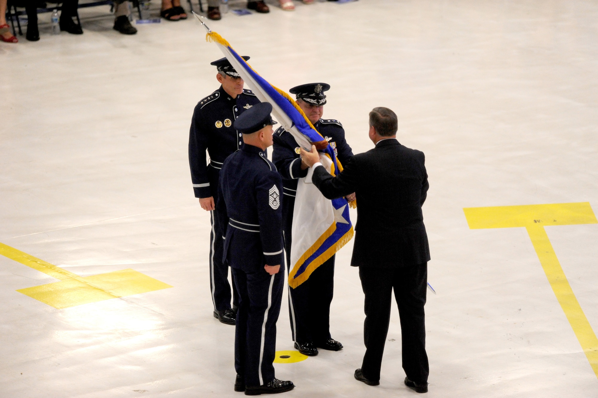 Secretary of the Air Force Michael Donley passes the chief of staff flag to Gen. Mark A. Welsh III during a ceremony at Joint Base Andrews, Md., Aug. 10, 2012. Prior to his new position, Welsh was the commander of U.S. Air Forces in Europe. (U.S. Air Force photo/Master Sgt. Cecilio Ricardo)