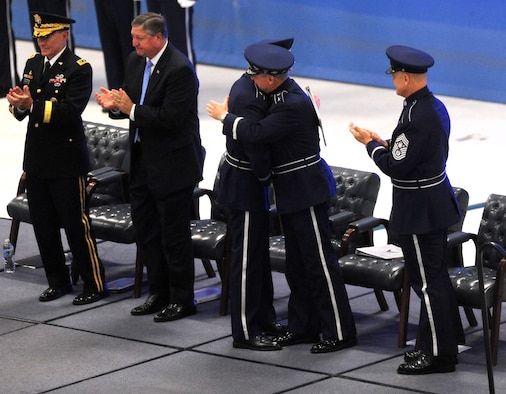 Air Force Chief of Staff Gen. Norton Schwartz embraces Gen. Mark A. Welsh III during the chief of staff transition ceremony at Joint Base Andrews, Md., Aug. 10, 2012. Schwartz served in the Air Force for 39 years, the last four years as the Air Force’s senior uniformed leader. Prior to becoming the Air Force chief of staff, Welsh commanded U.S. Air Forces in Europe. (U.S. Air Force photo/Master Sgt. Cecilio Ricardo)