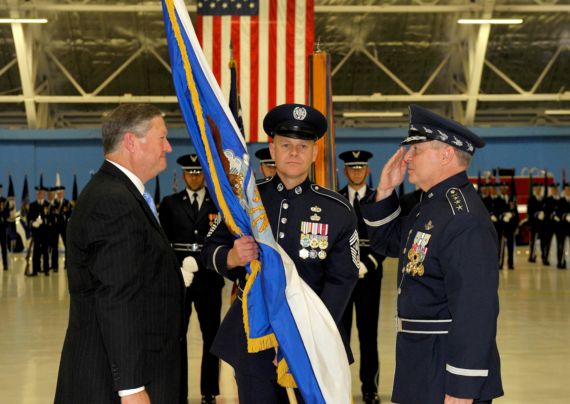 Secretary of the Air Force Michael Donley passes the chief of staff flag to Gen. Mark A. Welsh III during a ceremony at Joint Base Andrews, Md., Aug. 10, 2012. Prior to his new position, Welsh was the commander of U. S. Air Forces in Europe. (U.S. Air Force photo/ Michael J. Pausic)