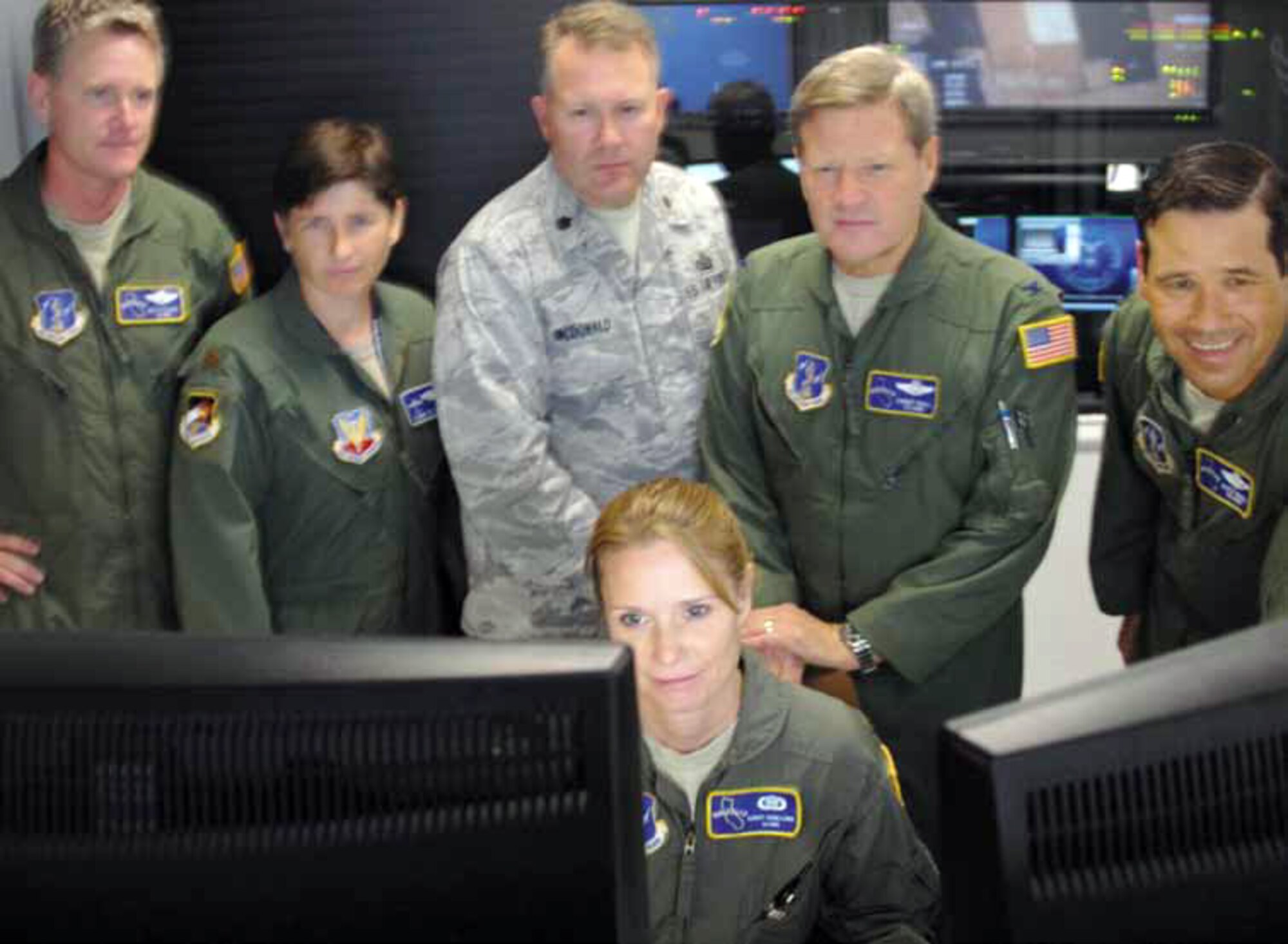 The 163rd Reconnaissance Wing participated in the Grizzly Field Exercise, July
25. During spin-up of the exercise, the intensity of focus was easily observed in the Predator Operations Center (POC) at March Air Reserve Base Calif., as members of the 163d RW hovered over computer monitors and flight plans in final preparation for GFX 12. (U.S. Air Force photo by Tech. Sgt. Neil S. Ballecer)