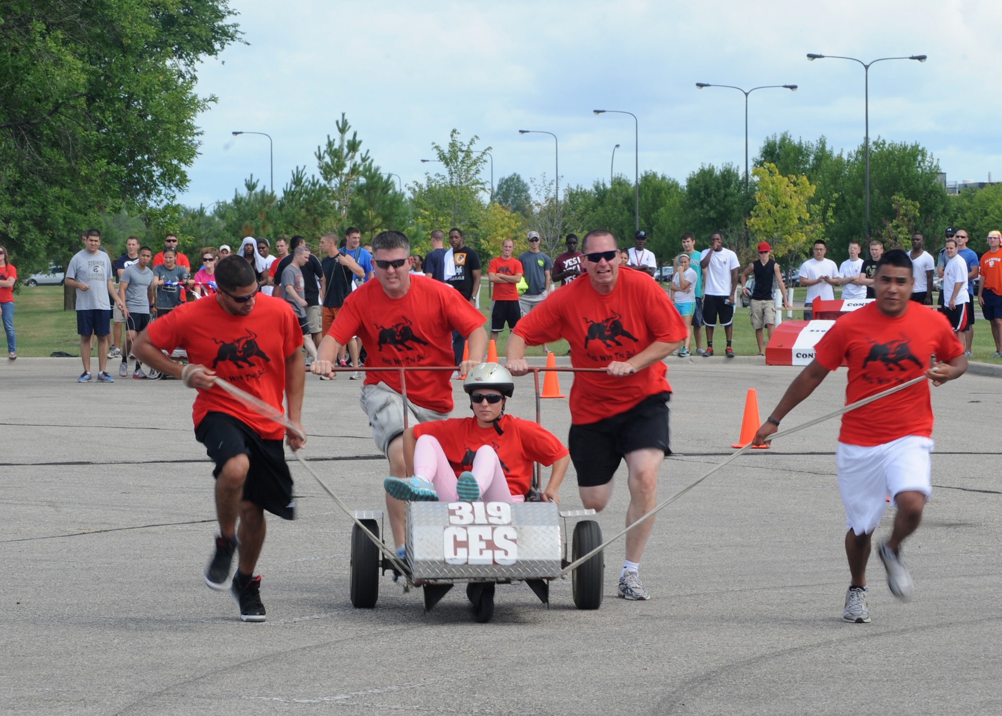Members of the 319th Civil Engineering Squadron participate in the bed race Aug 9, during Summer Bash 2012 on Grand Forks Air Force Base, N.D. The 319th Operations Support Squadron placed first overall, with the 319th Civil Engineer Squadron placing second and the 69th Reconnaissance Group placing third. (U.S. Air Force photo/Senior Airman Amber Bennett)