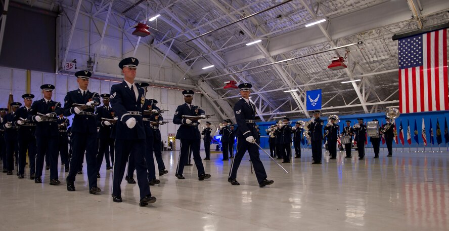 The U.S. Air Force Honor Guard and U.S. Air Force Band perform a pass and review on Aug. 10, 2012, at Joint Base Andrews, Md. for the Air Force Chief of Staff transition ceremony. During the ceremony, Gen. Norton Schwartz retired from active duty and passed on the duty of Air Force Chief of Staff to Gen. Mark A. Welsh III. (U.S. Air Force Photo/Senior Airman Perry Aston)