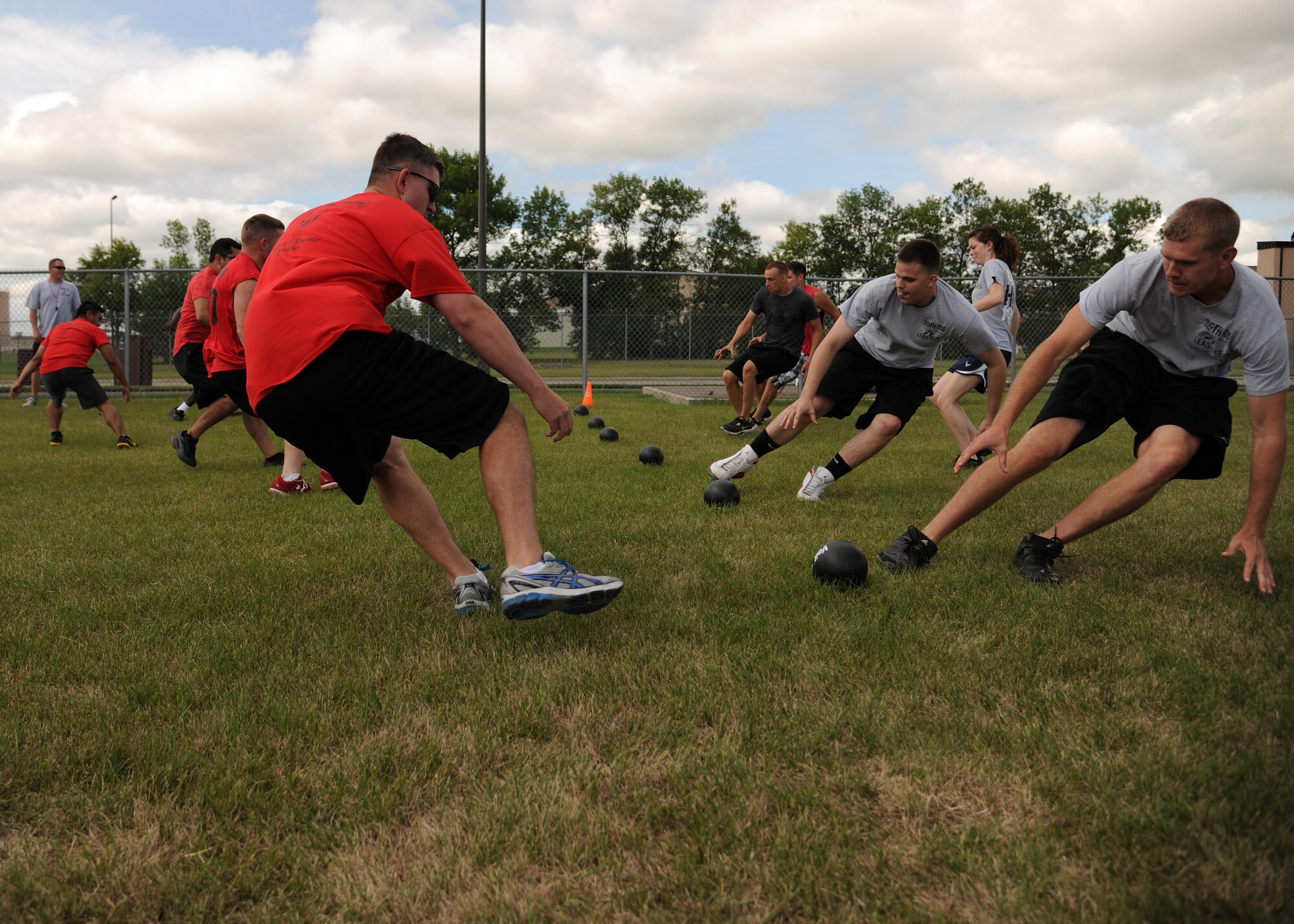 Members of the 319th Civil Engineer Squadron compete against members of the 319th Operations Support Squadron, in a game of dodgeball Aug. 9 during at Summer Bash 2012, on Grand Forks Air Force Base, N.D. Summer Bash is an annual event designed to boost morale and increase esprit de corps. The 319th Operations Support Squadron placed first overall, with the 319th Civil Engineer Squadron placing second and the 69th Reconnaissance Group placing third. (U.S. Air Force photo/Airman 1st Class Ashley N. Taylor)