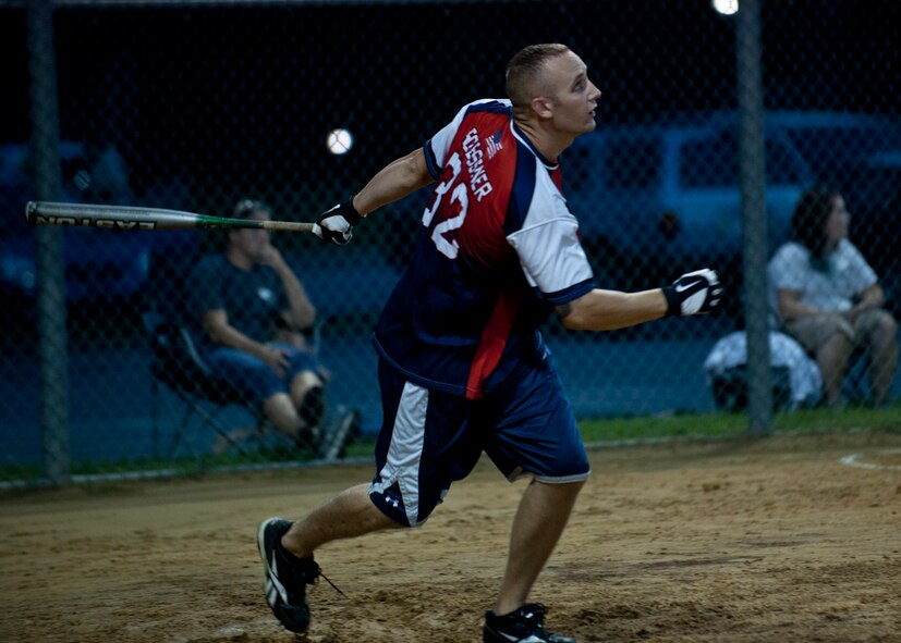 Anthony Roessner, 23d Equipment Maintenance Squadron munitions storage crew chief, hits the ball and begins running to first base during the 2012 Moody Intramural Softball Championship game Aug. 8, 2012, at Moody Air Force Base, Ga. Roessner is the right center fielder for his team EMS, that competed against team 723 AMXS who took the first place trophy with a winning score of 15-13. (U.S. Air Force photo by Senior Airman Eileen Meier/Released)