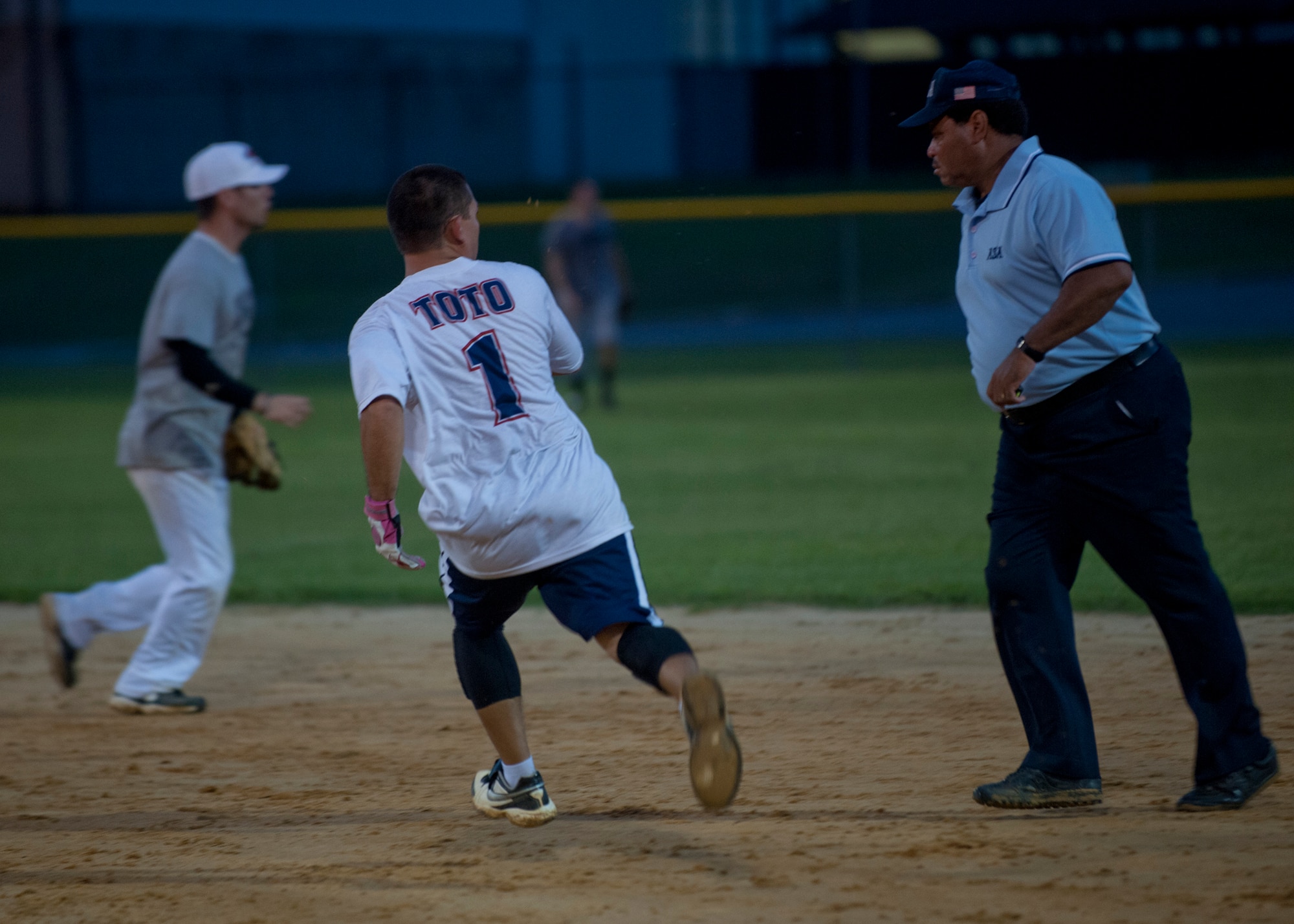 Richard Jenkins, 23d Equipment Maintenance Squadron assistant noncommissioned officer in charge of munitions storage, runs to second base during the 2012 Moody Intramural Softball Championship game Aug. 8, 2012, at Moody Air Force Base, Ga. Jenkins is the second baseman and coach for team EMS, and they competed against team 723 AMXS who took first place with a score of 15-13. (U.S. Air Force photo by Senior Airman Eileen Meier/Released)
