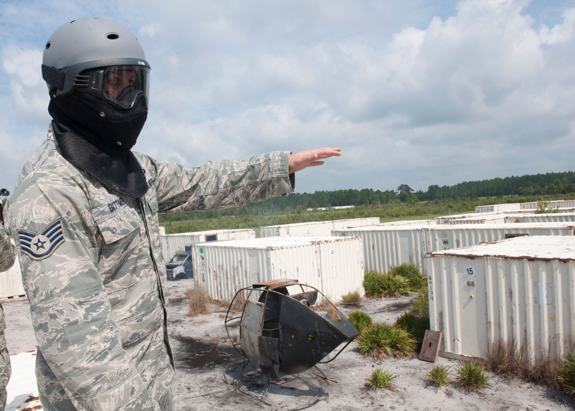 U.S. Air Force Staff Sgt. Joseph Dittmer, 347th Operations Support Squadron survival, evasion, resistance and escape instructor, explains a scenario that will be performed by SERE specialists at the Grand Bay Bombing and Gunnery Range at Moody Air Force Base, Ga., Aug. 1, 2012.  A demonstration was held to show base leadership survival tactics and how to evade capture under enemy attack. (U.S. Air Force photo by Senior Airman Eileen Meier/Released)
