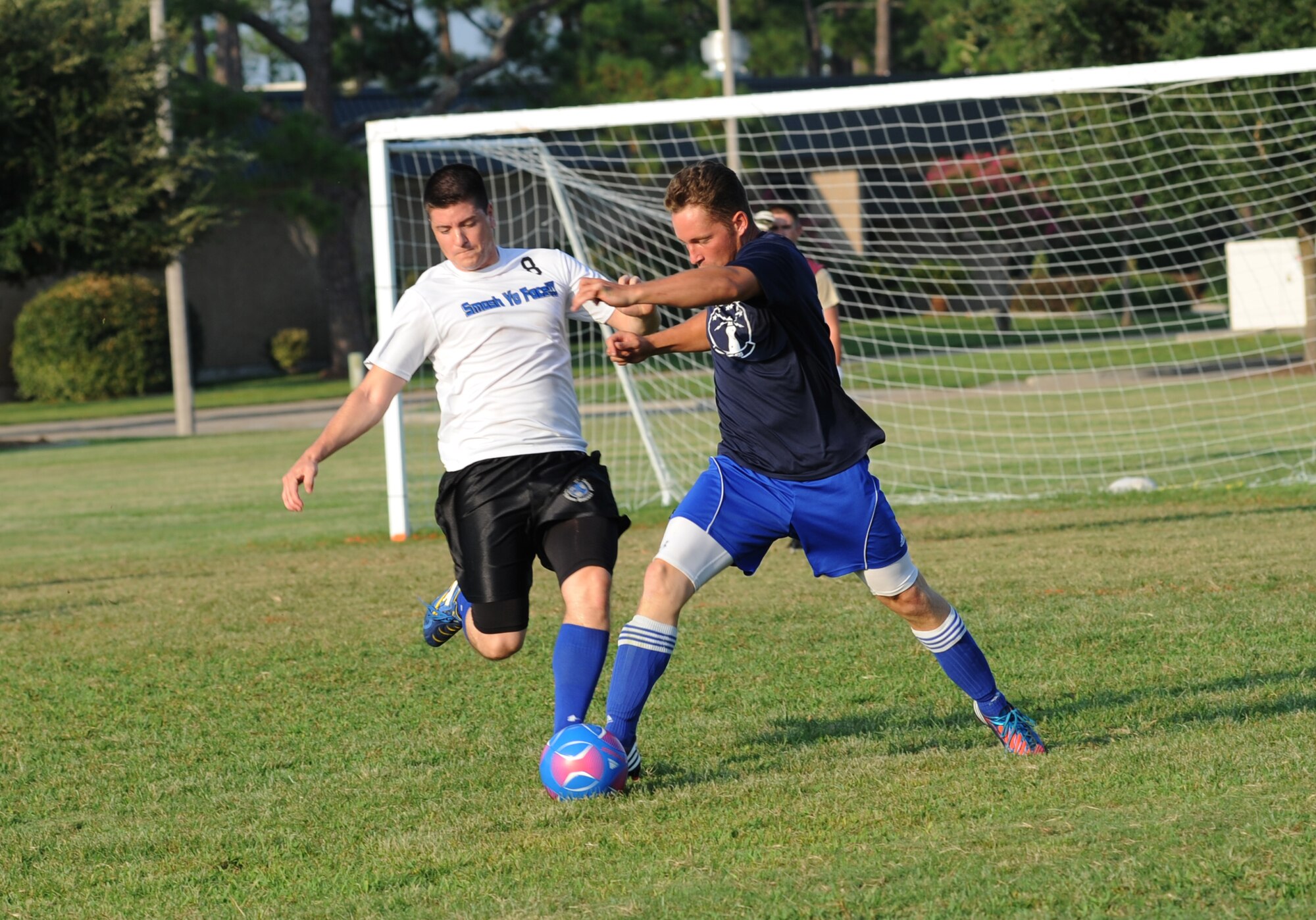 Rodrigo Paes, 334th Training Squadron, William Boxx and Matthew Weber, 85th Engineering Installation Squadron, and Tony Bridgewater, 334th TRS, run into their place of position as Justin Rae, 85th EIS, dribbles the soccer ball toward his team’s goal during an intramural soccer game August 7, 2012, at Keesler Air Force Base, Miss.  The Gators defeated the 85th 6-2.  (U.S. Air Force photo by Kemberly Groue)