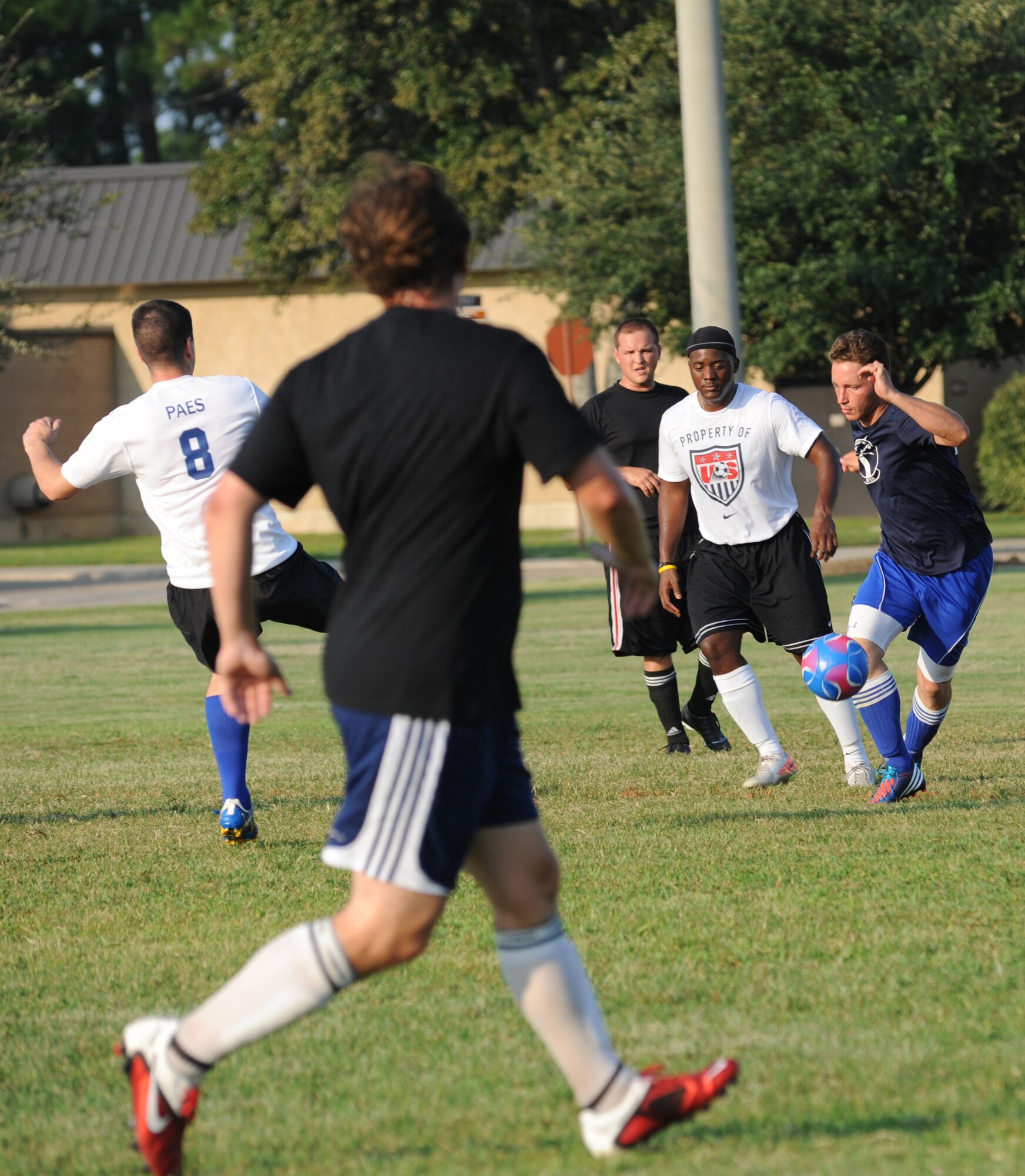 Rodrigo Paes, 334th Training Squadron, William Boxx and Matthew Weber, 85th Engineering Installation Squadron, and Tony Bridgewater, 334th TRS, run into their place of position as Justin Rae, 85th EIS, dribbles the soccer ball toward his team’s goal during an intramural soccer game August 7, 2012, at Keesler Air Force Base, Miss.  The Gators defeated the 85th 6-2.  (U.S. Air Force photo by Kemberly Groue)