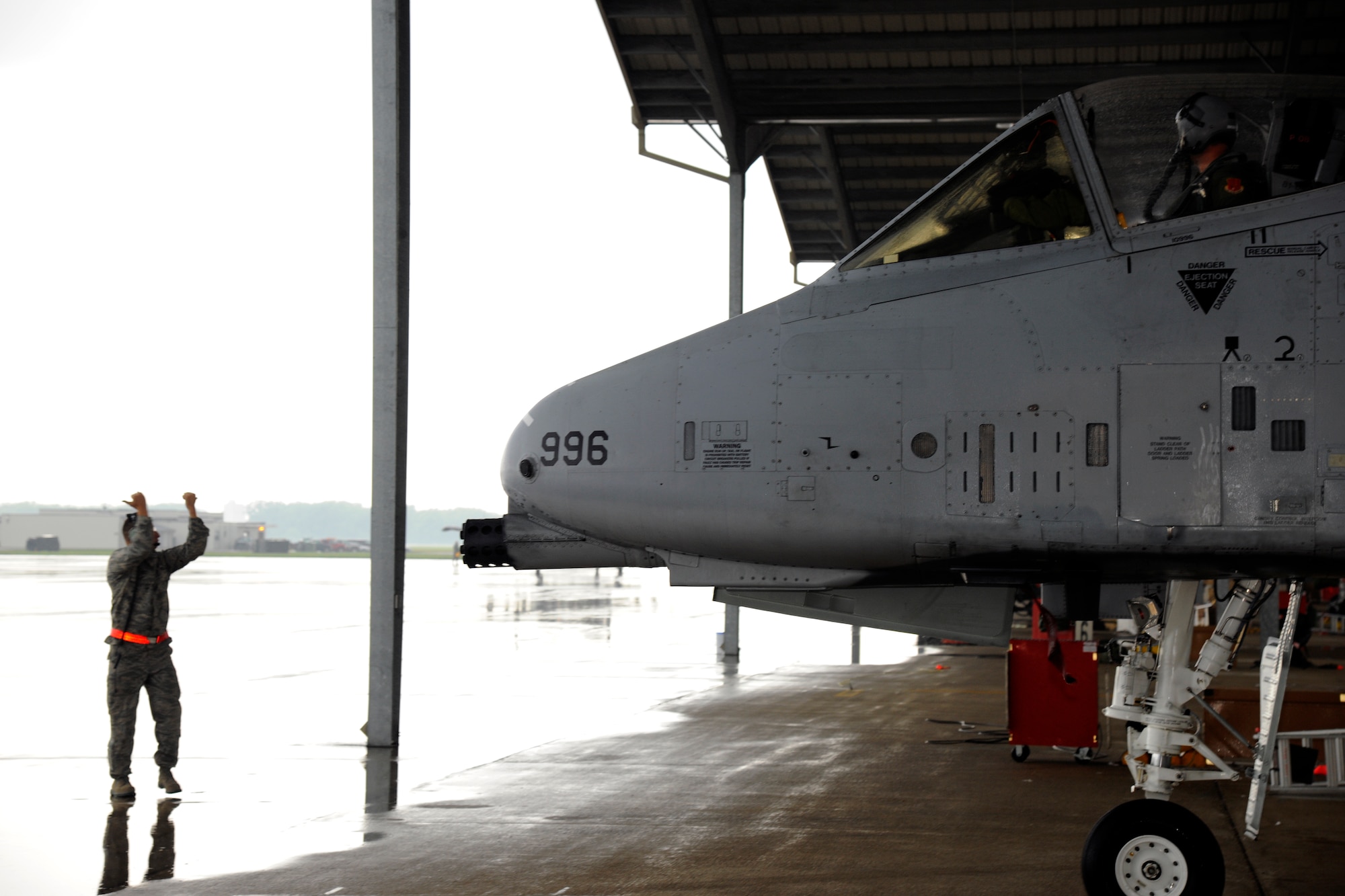 TSgt Recardo Perez, a crew chief from the 127th Aircraft Maintenance Squadron, marshals an A-10 Thunderbolt II to the flight line for a lunch during flight operations on Selfridge Air National Guard Base, Mich., Aug. 10, 2012. The 127th AMXS crew launched, recovered, and turned A-10s throughout the day, during a surge operation.  (Air National Guard photo by TSgt. David Kujawa)