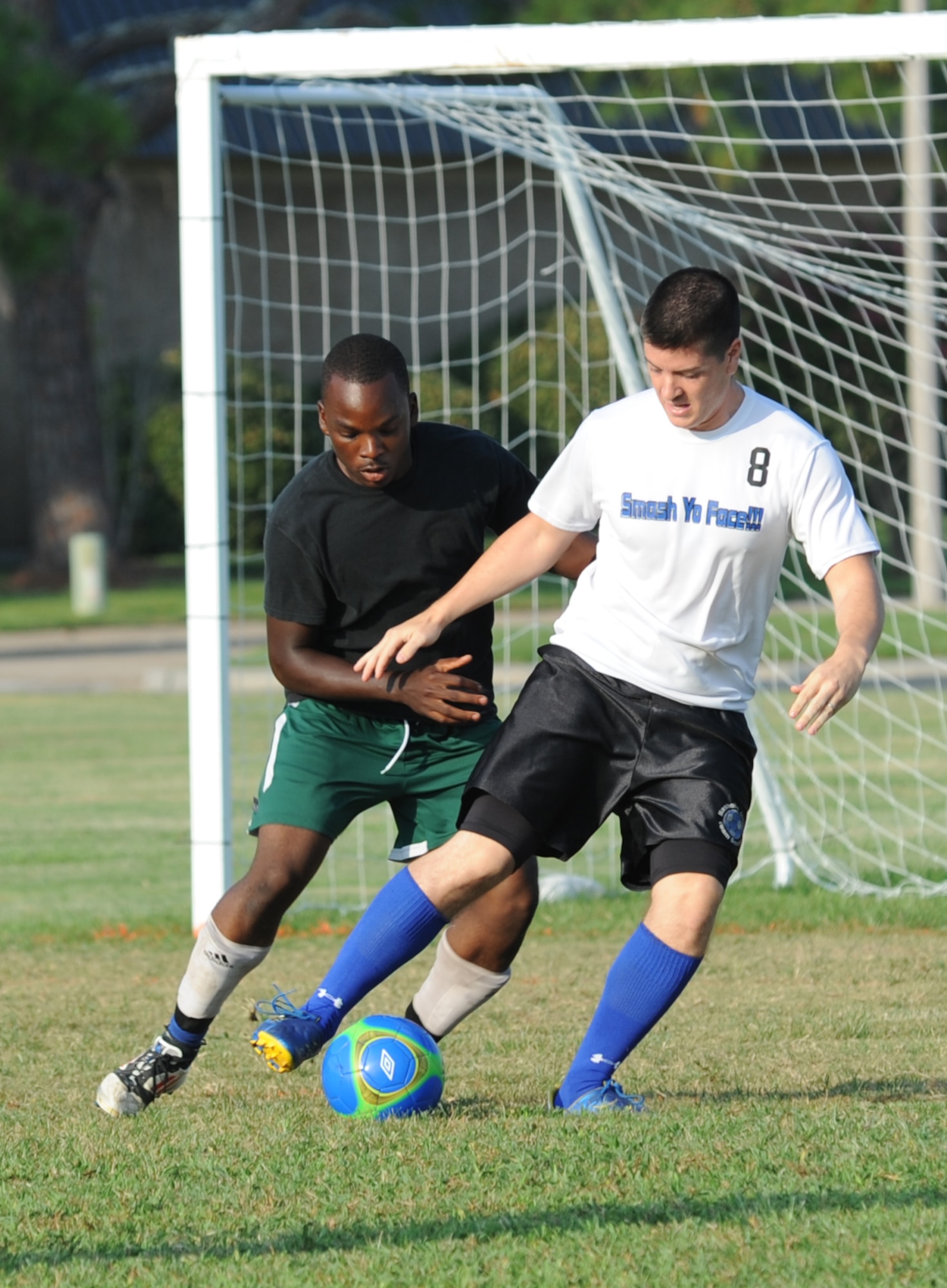 Rajab Kigembe, 85th Engineering Installation Squadron, and Rodrigo Paes, 334th Training Squadron, battle for the ball during an intramural soccer game August 7, 2012, at Keesler Air Force Base, Miss.  The Gators defeated the 85th 6-2.  (U.S. Air Force photo by Kemberly Groue)