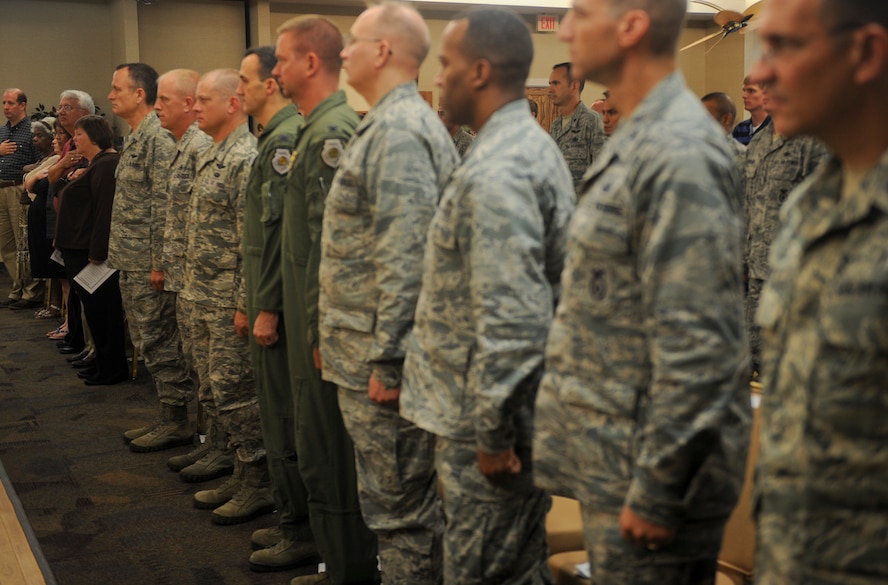 Moody Airmen stand at attention for the playing of the national anthem during an assumption of command ceremony at Moody Air Force Base, Ga., Aug. 9, 2012. During the ceremony, the 23d Contracting Squadron welcomed the new commander, U.S. Air Force Maj. Jonathan Czarney. (U.S. Air Force photo by Airman 1st Class Douglas Ellis/Released)
