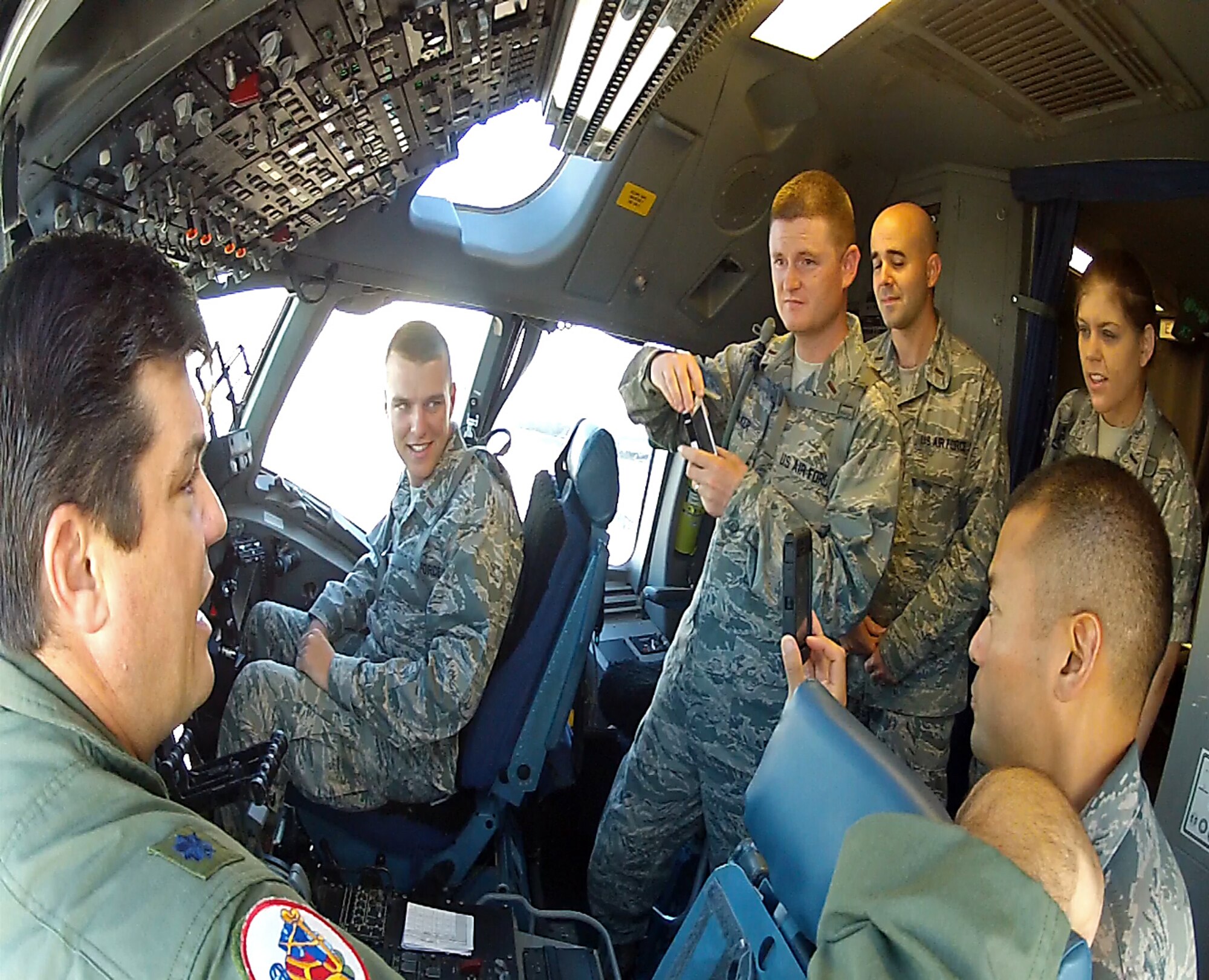 Lt. Col. Mike Phillips, 701st Airlift Squadron pilot" tells a visiting group of Chaplain candidates about the flight deck on a C-17 Globemaster III during the group's visit to Joint Base Charleston Aug. 9, 2012. (U.S. Air Force photo / Michael Dukes)
