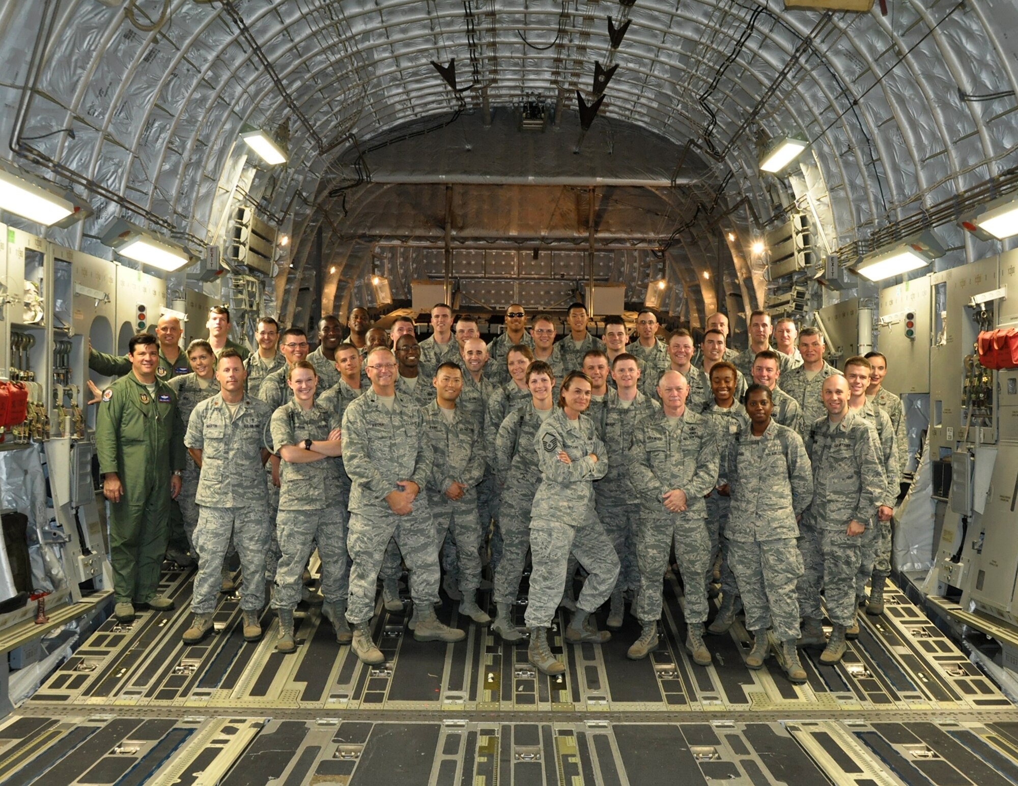 Members of the 315th Airlift Wing take a moment for a group photo with visiting group from the Air Force Chaplain Candidate program inside a C-17 Globemaster III during the group's visit to Joint Base Charleston Aug. 9, 2012. (U.S. Air Force photo / Michael Dukes)