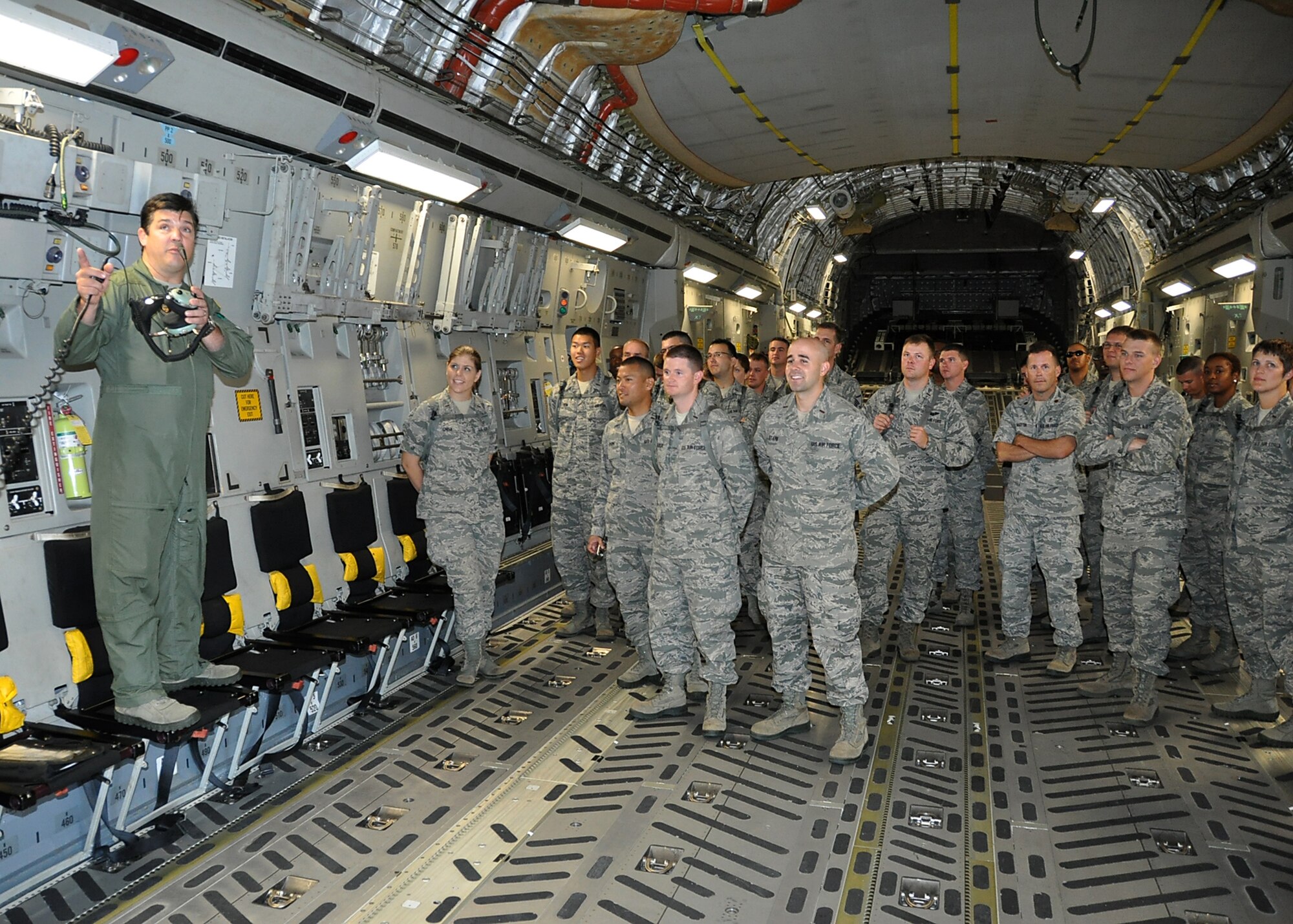 Lt. Col. Mike Phillips, 701st Airlift Squadron pilot" tells a visiting group of Chaplain candidates about the C-17 Globemaster III during the group's visit to Joint Base Charleston Aug. 9, 2012. (U.S. Air Force photo / Michael Dukes)