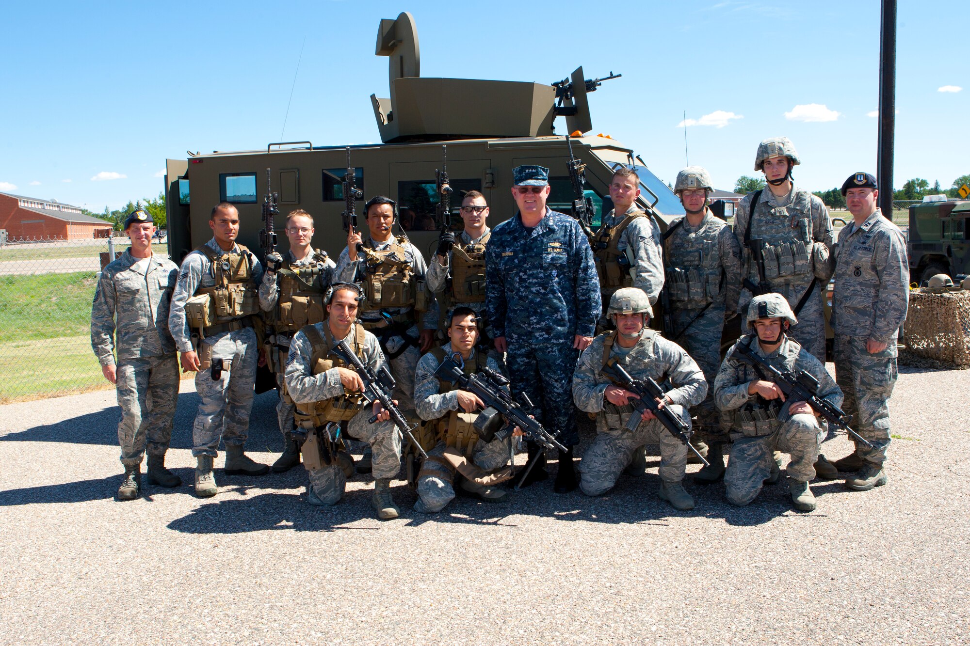 Navy Vice Adm. Timothy Giardina, United States Strategic Command deputy commander, poses with members of the 90th Security Forces Group tactical response force, after a demonstration at Uniform-2 on F. E. Warren Air Force Base, Wyo. (U.S. Air Force photo by Matt Bilden)
