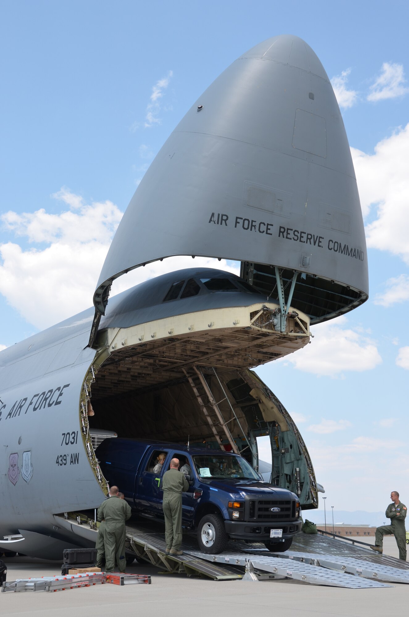 Westover Airmen unload a C-5 in Colorado Springs, Colo., Aug. 8. Members from five Airlift Control Flights are particpating in Exercise Patriot Express, an annual Air Force Reserve Command exercise. (U.S. Air Force photo/SrA. Kelly Galloway)