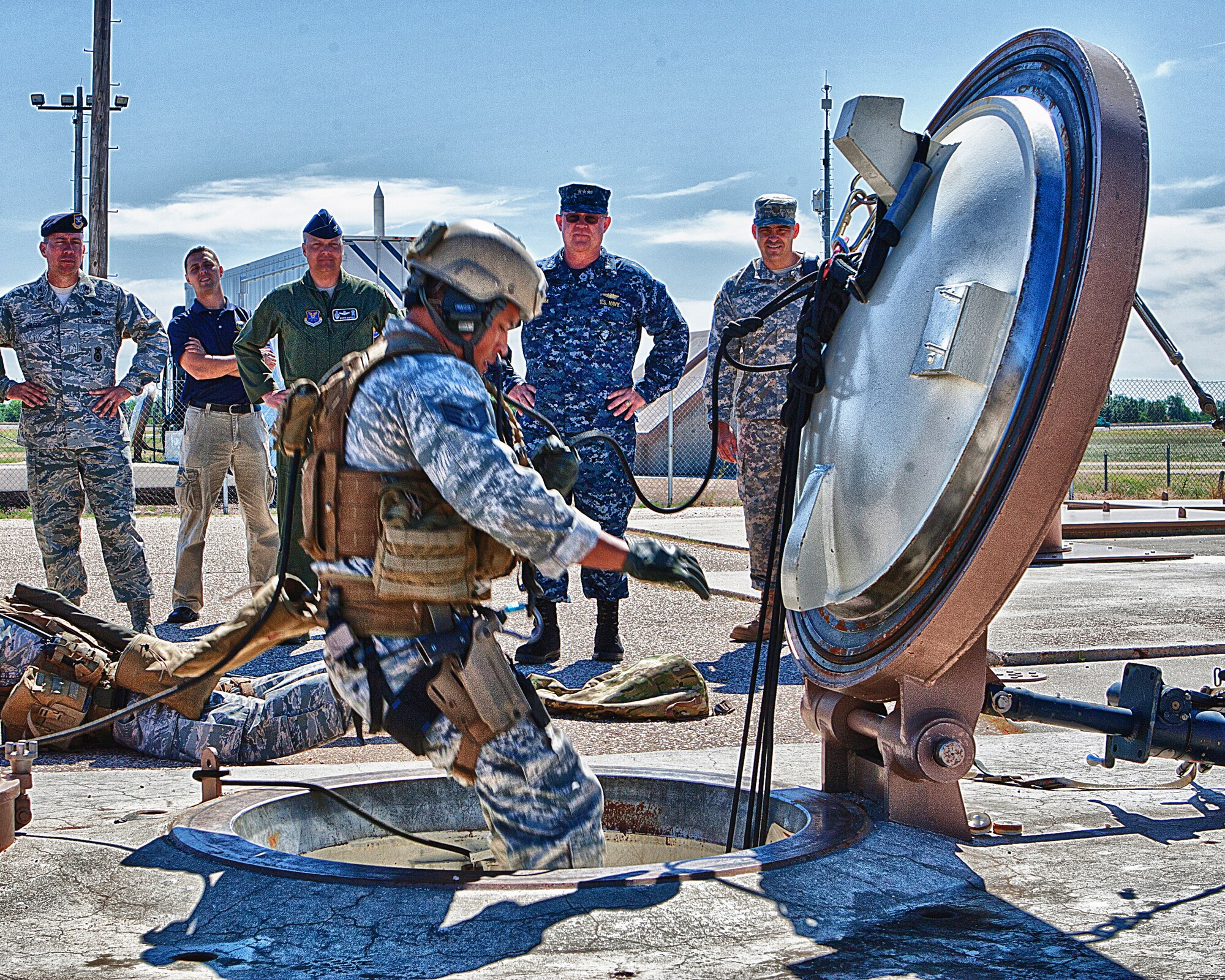 A staff sergeant from the 90th Security Forces Group tactical response force takes a fast rope into the Uniform-2 launch facility trainer on F. E. Warren Air Force Base, Wyo., July 31, as part of a demonstration. The TRF demonstration was one portion of the 90th Missile Wing orientation tour for Navy Vice Adm. Timothy Giardina, United States Strategic Command deputy commander. (U.S. Air Force photo by Matt Bilden)
