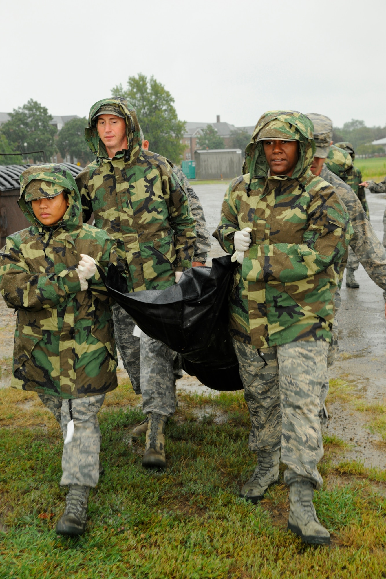 Members of the 127th Force Support Squadron carry the remains of a simulated casualty during a field training exercise at Selfridge Air National Guard Base, Mich., Aug. 9, 2012.  The members of 127th FSS’s training included setting up a field kitchen and tents for mortuary affairs as well as search and rescue purposes.  (Air National Guard photo by TSgt. David Kujawa)