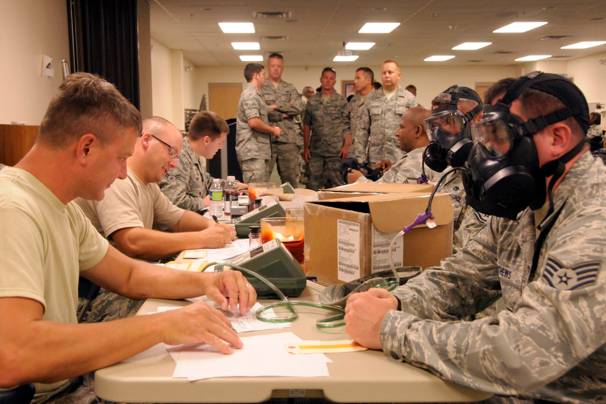 Airmen wearing new M-50 Joint Service General Purpose Mask run through a series of environmental tests to ensure that their new gas mask is functioning properly. The testing was being conducted by the 127th Wing at Selfridge Air National Guard Base, Mich., Aug. 8, 2012. The mask is being issued to all Air Force personnel, replacing an early version gas mask. The new mask improves air flow and visibility for the wearer. (Air National Guard photo by Brittani Baisden)