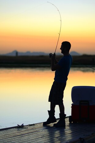 Michael Viel reels in a catch at Lower Blackwelder Lake Tuesday evening July 31, 2012 at Beale Air Force Base, Calif. Viel is a contracter with the 9th Maintenance Squadron. (U.S. Air Force photo by Airman 1st Class Andrew Buchanan)