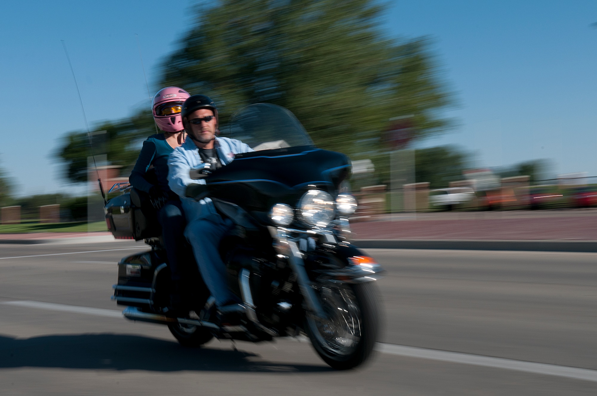 Troy Weaver and Staff Sgt. Vanessa Harsh, both with the 90th Missile Wing Safety Office, depart F. E. Warren Air Force Base, Wyo., Aug. 3, as part of the Command Chief Motorcycle Mentorship Ride. Approximately 30 riders took part in the ride organized by the safety office to help younger riders learn from more experienced riders. (U.S. Air Force photo by R.J. Oriez)
