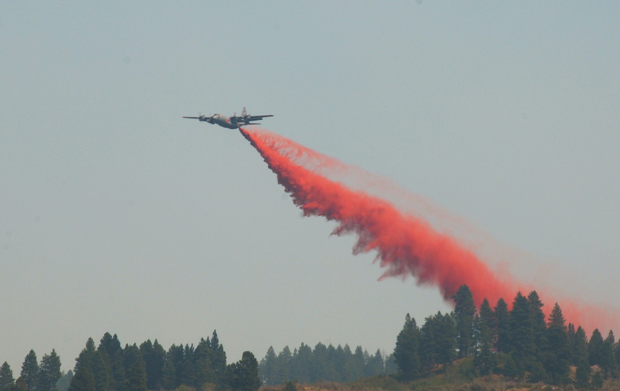 A Modular Airborne Fire Fighting System C-130 from the Air Force Reserve Command's 302nd Airlift Wing makes a retardant drop on the Springs fire near Banks, Idaho, just north of Eagle. On Aug. 9, MAFFS 5, assigned to the Colorado Reserve wing, made the 500th retardant drop for this year's MAFFS operations. A MAFFS-equipped C-130 assigned to the 302nd AW also dropped the the one millionth gallon of retardant since MAFFS began flying aerial fire fighting missions in support of the U.S. Forest Service on June 25. (U.S. Air Force photo/ Master Sgt. Dave Buttner)