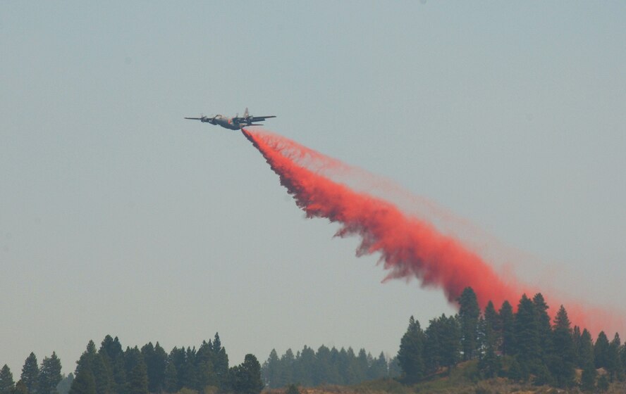 A Modular Airborne Fire Fighting System C-130 from the Air Force Reserve Command's 302nd Airlift Wing makes a retardant drop on the Springs fire near Banks, Idaho, just north of Eagle. On Aug. 9, MAFFS 5, assigned to the Colorado Reserve wing, made the 500th retardant drop for this year's MAFFS operations. A MAFFS-equipped C-130 assigned to the 302nd AW also dropped the the one millionth gallon of retardant since MAFFS began flying aerial fire fighting missions in support of the U.S. Forest Service on June 25. (U.S. Air Force photo/ Master Sgt. Dave Buttner)