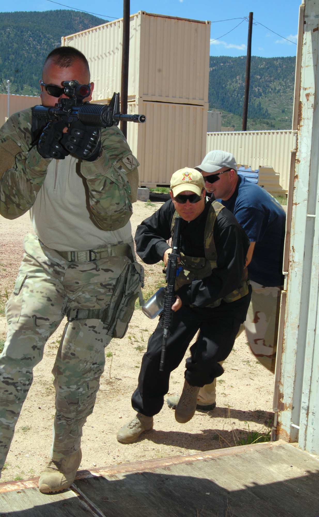 Master Sgt. Joseph Palmer and other mobile operations in urban terrain instructors demonstrate how to clear a room. Palmer is assigned to the 93rd Air Ground Operations Wing at Moody Air Force Base, Ga.    (U.S. Air Force Photo/Don Branum)