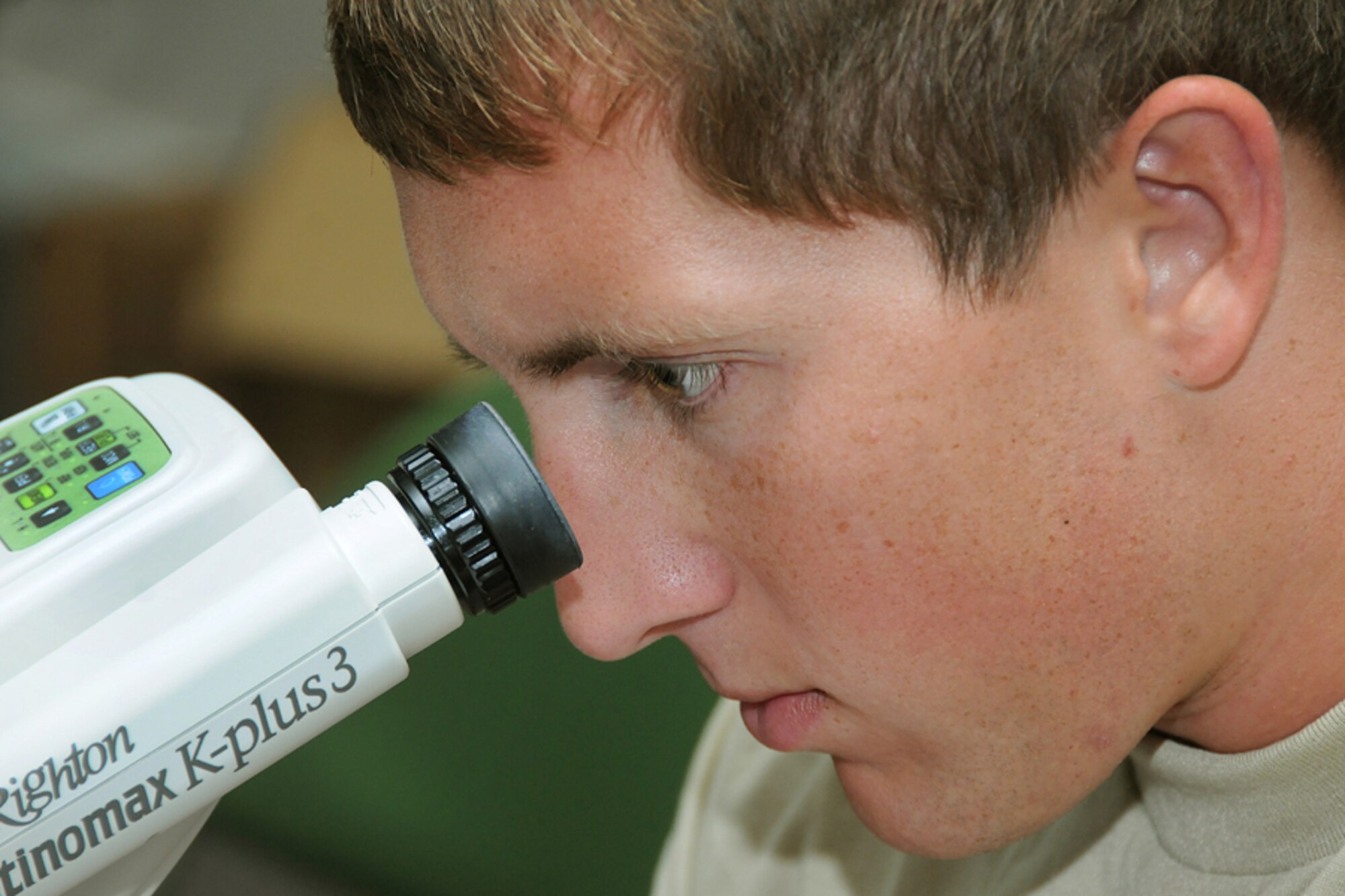 Senior Airman Bryson Kondracki, 136th Medical Group, Texas Air National Guard, utilizes auto-refraction equipment to check the eye prescription of an Alabama resident at a Selma optometry clinic during the Innovative Readiness Training mission Alabama Care 2012 in Selma, Ala. Aug. 8, 2012. IRT Alabama Care 2012 is an Air National Guard led, multiservice mission comprised of active, reserve, and National Guard members from Army, Navy and Air Force components providing service members with readiness training while providing Alabama residents with free health services such as dental, optometry and medical screenings in the medically underserved and economically depressed community of Selma, Ala. Aug. 7-14, 2012. (National Guard photo by Tech. Sgt. Melissa E. Chatham/RELEASED)