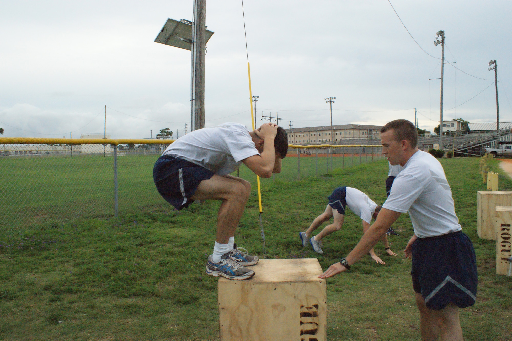 Airmen from the 366th Training Squadron Field Training Detachment 3 at Eglin Air Force Base, Fla., complete box jumps during Battlefield Survivability through Physical Fitness training July 19, 2012.  The revamped fitness program was instituted in January of 2012 to help Airmen at Naval School Explosive Ordnance Disposal get prepared for the physical rigors of the EOD career field. (U.S. Air Force photo/Dan Hawkins)