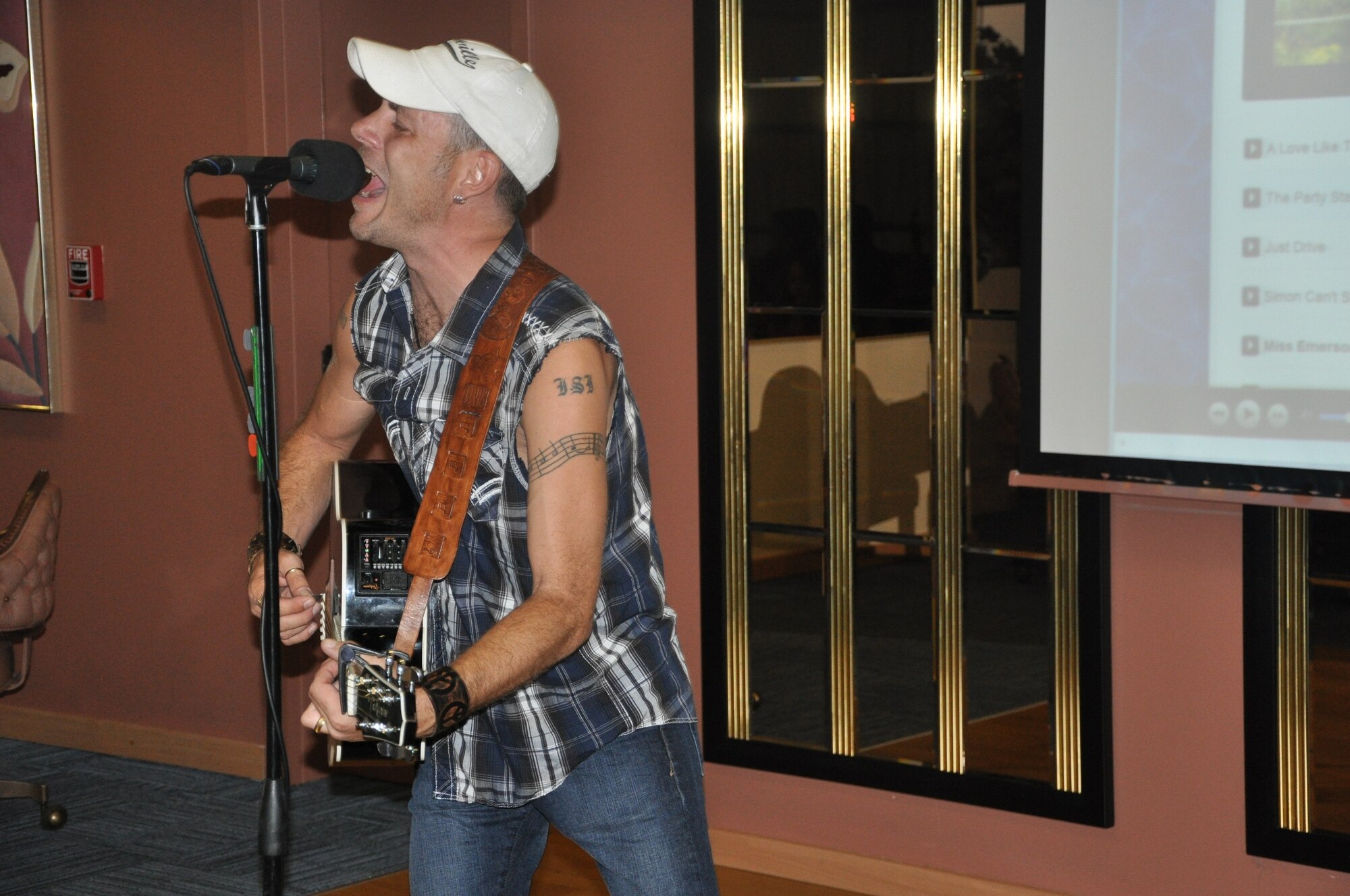 Country singer Jeff Harris performs a song during a concert at the Izmir Club Aug. 4, 2012, at Izmir Air Base, Turkey. Harris visited Izmir as part of an Armed Forces Entertainment tour, which provides entertainment for service members, civilians and their families stationed overseas. (U.S. Air Force photo by Tanju Varlikli)