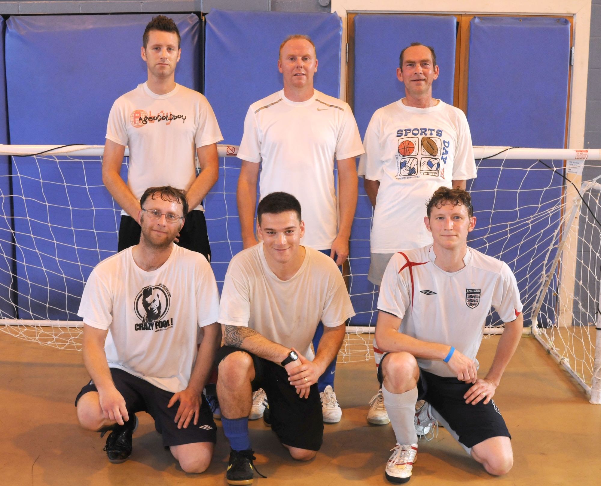 RAF MILDENHALL, England - From left top row, Andy Keogh, Martin Parker, Neil Houghton, bottom row, Barry King, Vincente Andrade, Damen Odey, all from the 100th Civil Engineer Squadron defeated the 100th Maintenance Squadron claiming the intramural indoor soccer championship Aug. 9, 2012 at the North Side Fitness Center. The team won the game with a final score of 9-2. (U.S. Air Force photo/Airman 1st Class Kelsey Waters) 