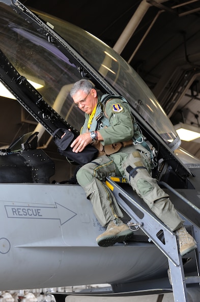 U.S. Air Force Lt. Gen. Sam Angelella, U.S. Forces, Japan, and 5th Air Force commander, boards an F-16 Fighting Falcon before a flight at Misawa Air Base, Japan, Aug. 10, 2012. During the visit to Misawa, Angelella met with the city mayor and Japan Air Self-Defense Force leadership to thank them for their continued support to U.S. servicemembers in the region.  (U.S. Air Force photo by Airman 1st Class Kia Atkins/Released) 